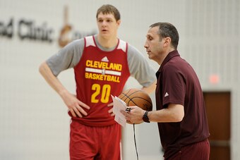 CLEVELAND, OH - MARCH 19:  Timofey Mozgov #20 and David Blatt of the Cleveland Cavaliers practice during an all-access event on March 19, 2015 in Cleveland, Ohio. NOTE TO USER: User expressly acknowledges and agrees that, by downloading and/or using this 