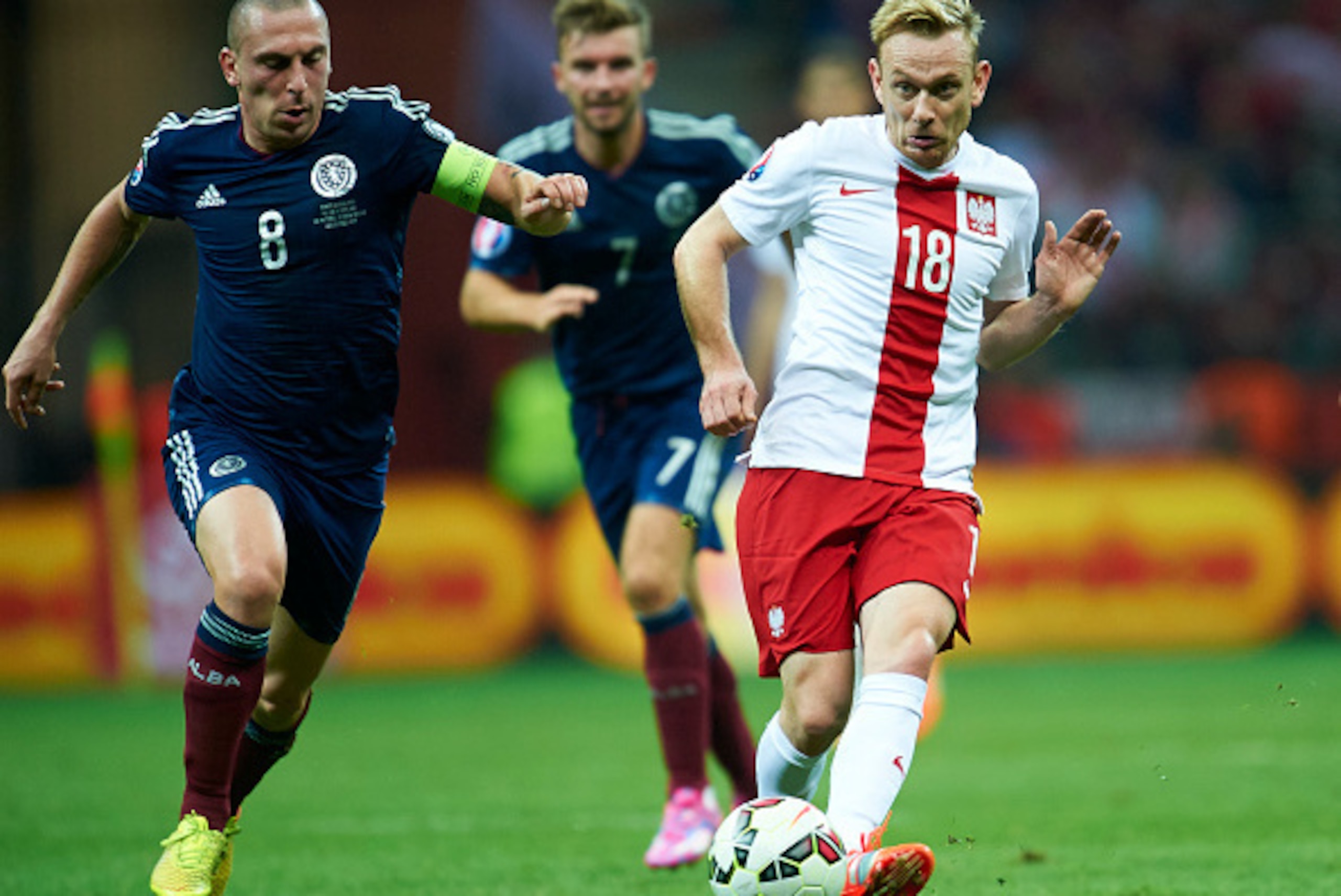 WARSAW, POLAND - OCTOBER 14: Poland's Sebastian Mila (R) fights for the ball with Scott Brown of Scotland (L) during the UEFA EURO 2016 qualifying match between Poland and Scotland on October 14, 2014 on the National Stadium in Warsaw, Poland. (Photo by WARSAW, POLAND - OCTOBER 14: Poland's Sebastian Mila (R) fights for the ball with Scott Brown of Scotland (L) during the UEFA EURO 2016 qualifying match between Poland and Scotland on October 14, 2014 on the National Stadium in Warsaw, Poland. (Photo by