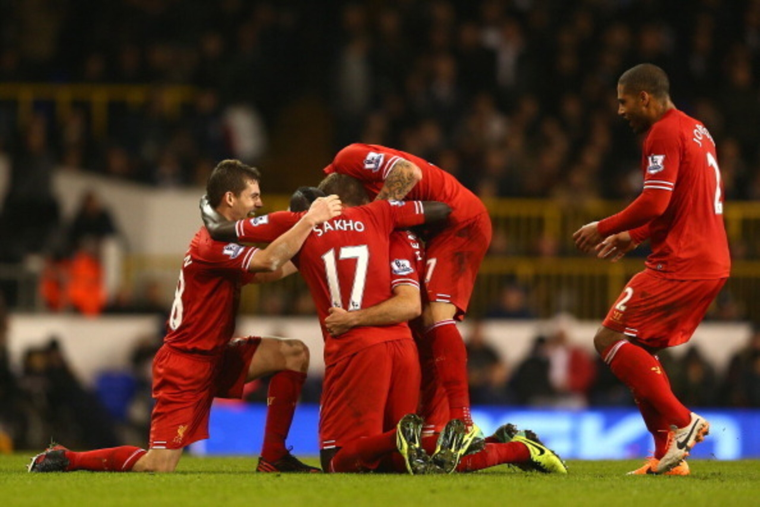 LONDON, ENGLAND - DECEMBER 15: Jordan Henderson of Liverpool is mobbed by his team mates after scoring their second goal during the Barclays Premier League match between Tottenham Hotspur and Liverpool at White Hart Lane on December 15, 2013 in London, E LONDON, ENGLAND - DECEMBER 15: Jordan Henderson of Liverpool is mobbed by his team mates after scoring their second goal during the Barclays Premier League match between Tottenham Hotspur and Liverpool at White Hart Lane on December 15, 2013 in London, E