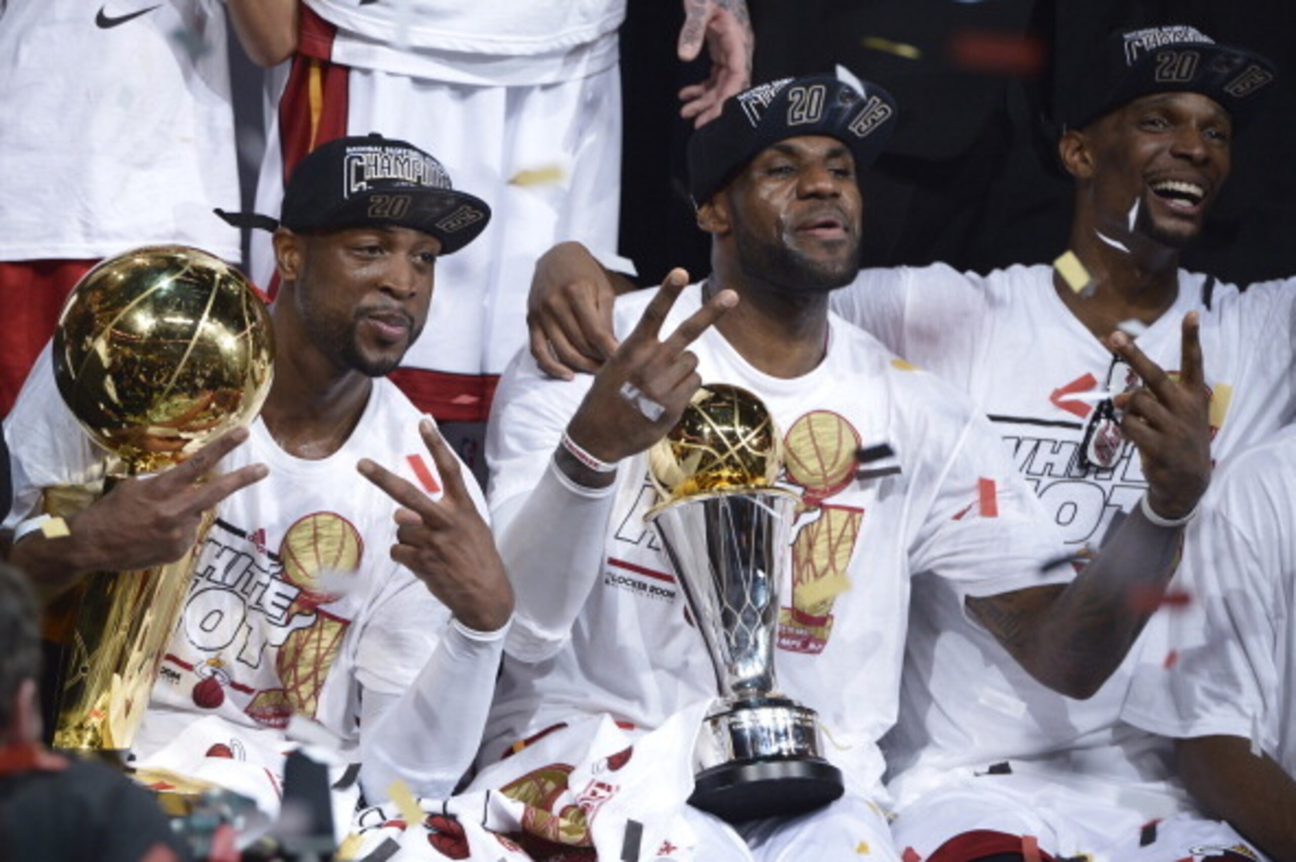 Dwyane Wade (L), LeBron James (C) and Chris Bosh (R) of the Miami Heat celebrate winning Game 7 of the NBA Finals at the American Airlines Arena June 20, 2013 in Miami, Florida. The Miami Heat, led by NBA Most Valuable Player LeBron James, won the NBA F Dwyane Wade (L), LeBron James (C) and Chris Bosh (R) of the Miami Heat celebrate winning Game 7 of the NBA Finals at the American Airlines Arena June 20, 2013 in Miami, Florida. The Miami Heat, led by NBA Most Valuable Player LeBron James, won the NBA F