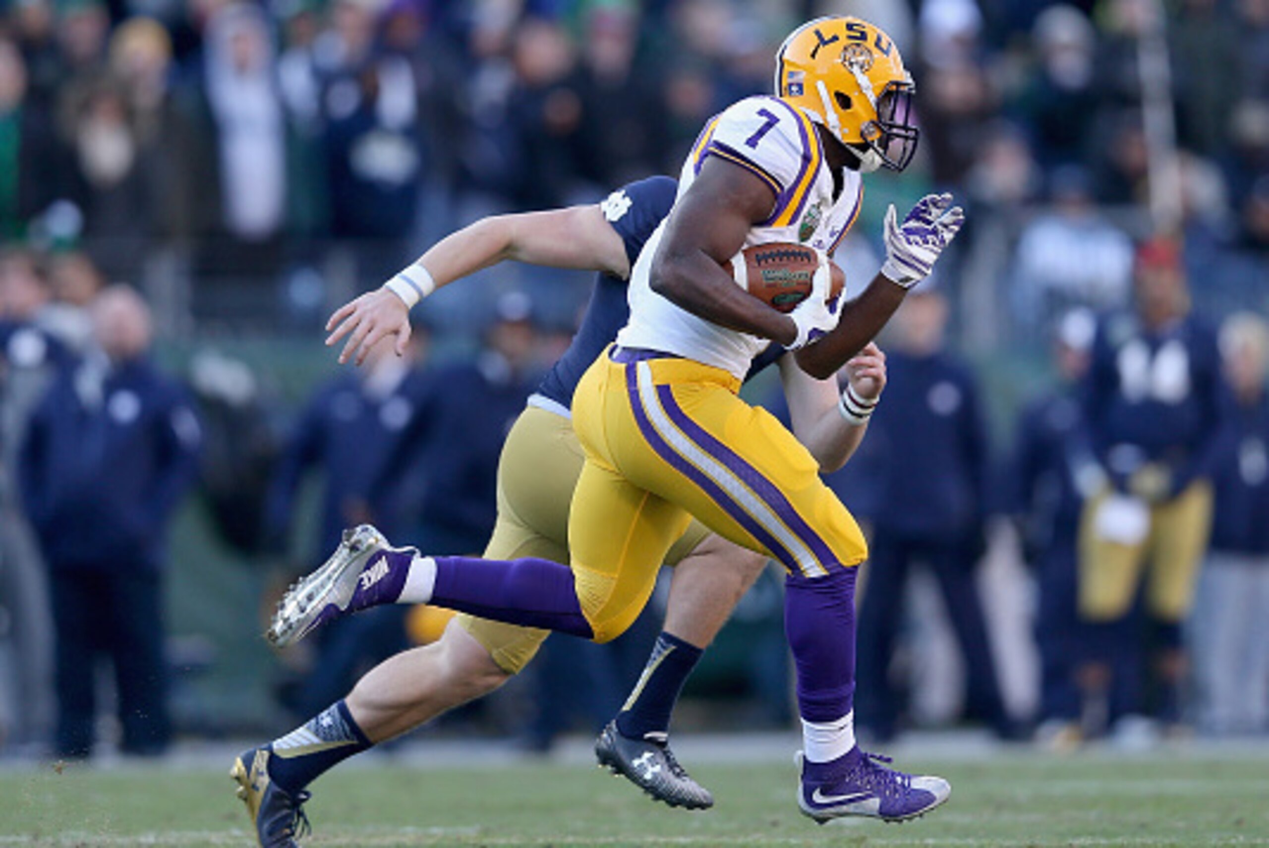 NASHVILLE, TN - DECEMBER 30:  Leonard Fournette #7 of the LSU Tigers runs for a touchdown against the Notre Dame Fighting Irish during the Franklin American Mortgage Music City Bowl at LP Field on December 30, 2014 in Nashville, Tennessee.  (Photo by Andy