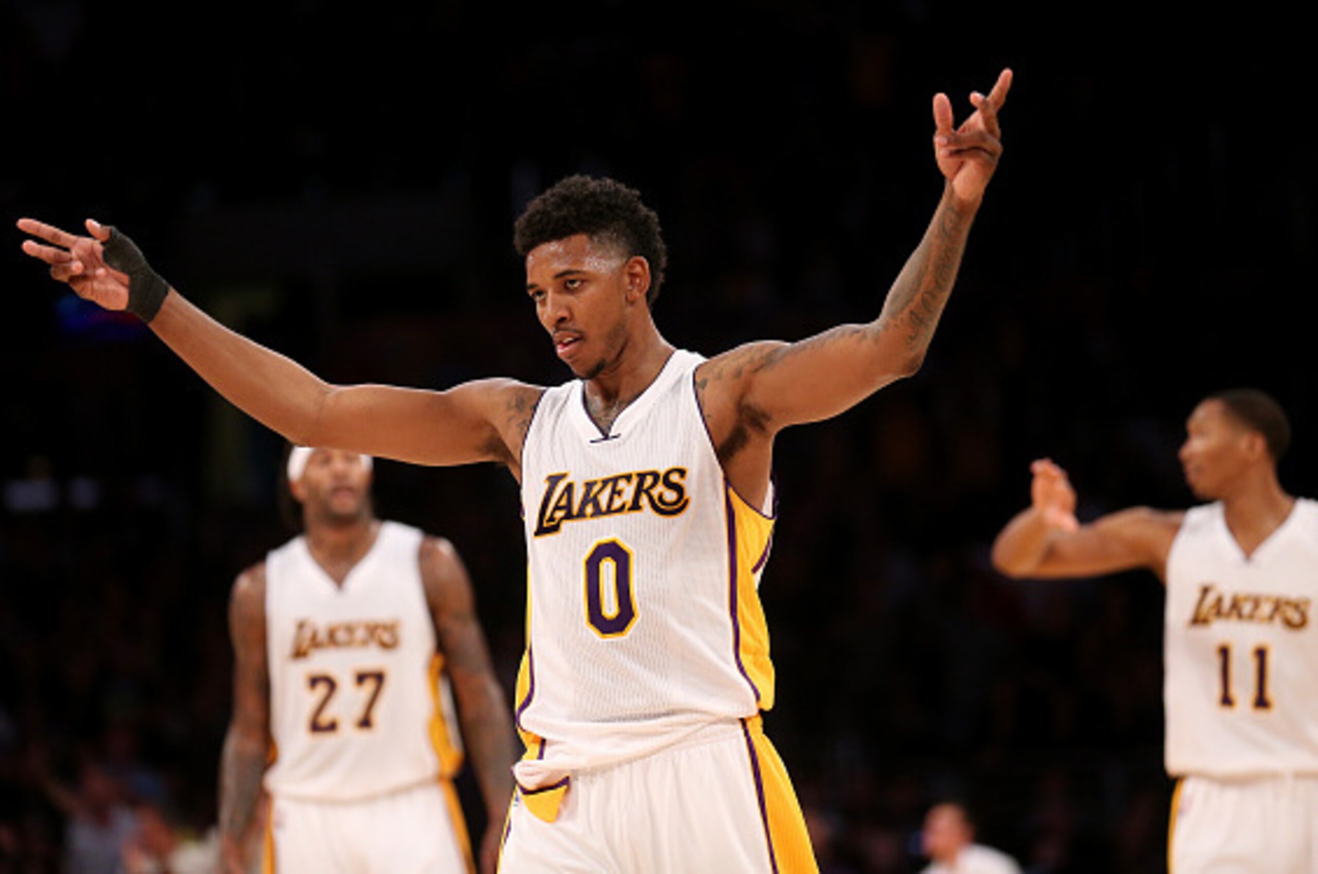 LOS ANGELES, CA - NOVEMBER 30:  Nick Young #0 of the Los Angeles Lakers celebrates in the fourth quarter against the Toronto Raptors at Staples Center on November 30, 2014 in Los Angeles, California. The Lakers 129-122 in overtime. NOTE TO USER: User expr