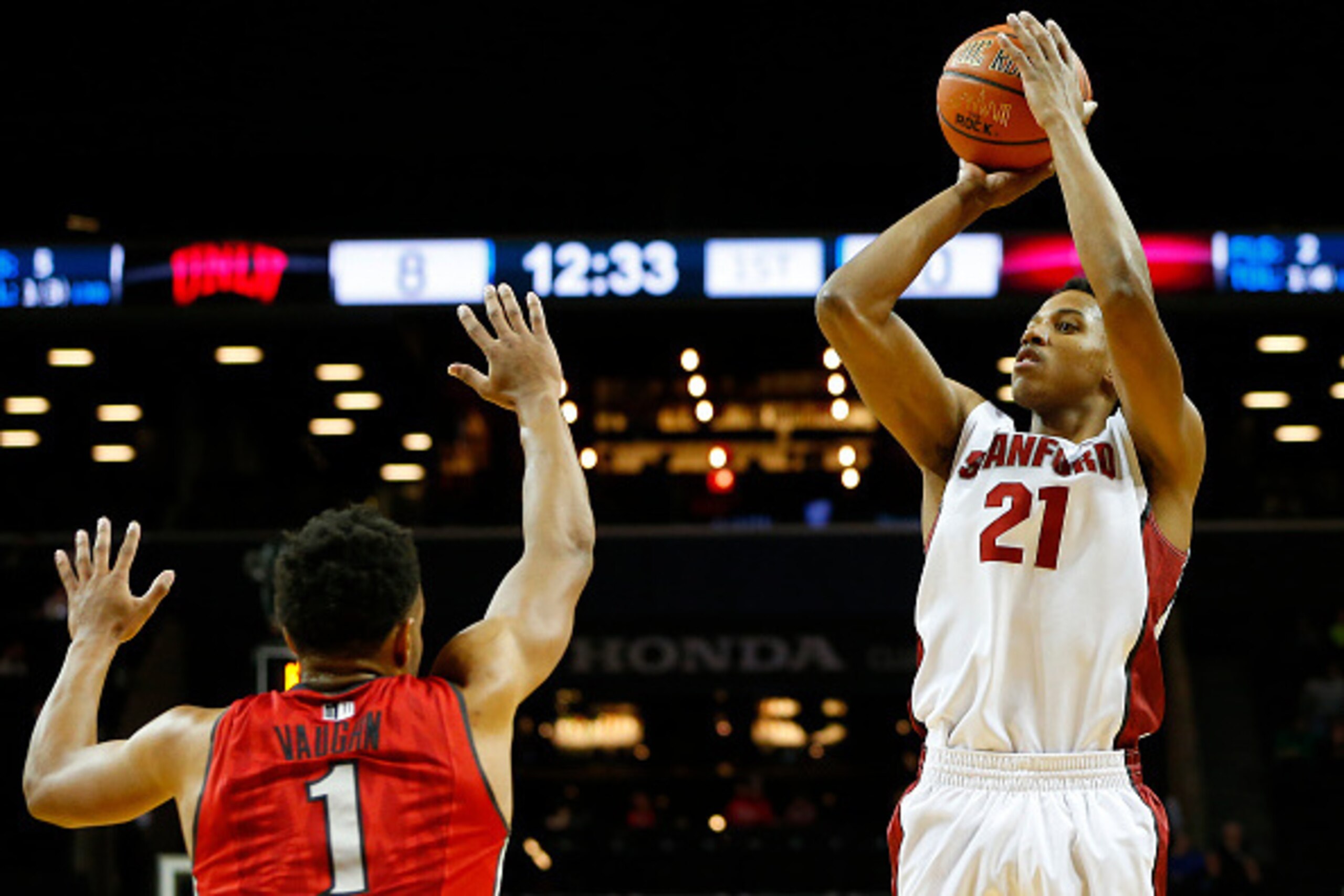 NEW YORK, NY - NOVEMBER 21: Anthony Brown #21 of the Stanford Cardinal takes a shot as Rashad Vaughn #1 the UNLV Rebels defends during the first half of a game in the Coaches vs Cancer Classic men's basketball tournament at Barclays Center on November 21,
