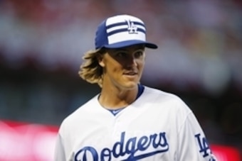 Jul 14, 2015; Cincinnati, OH, USA; National League pitcher Zack Greinke (21) of the Los Angeles Dodgers reacts after the second inning of the 2015 MLB All Star Game at Great American Ball Park. Mandatory Credit: Rick Osentoski-USA TODAY Sports