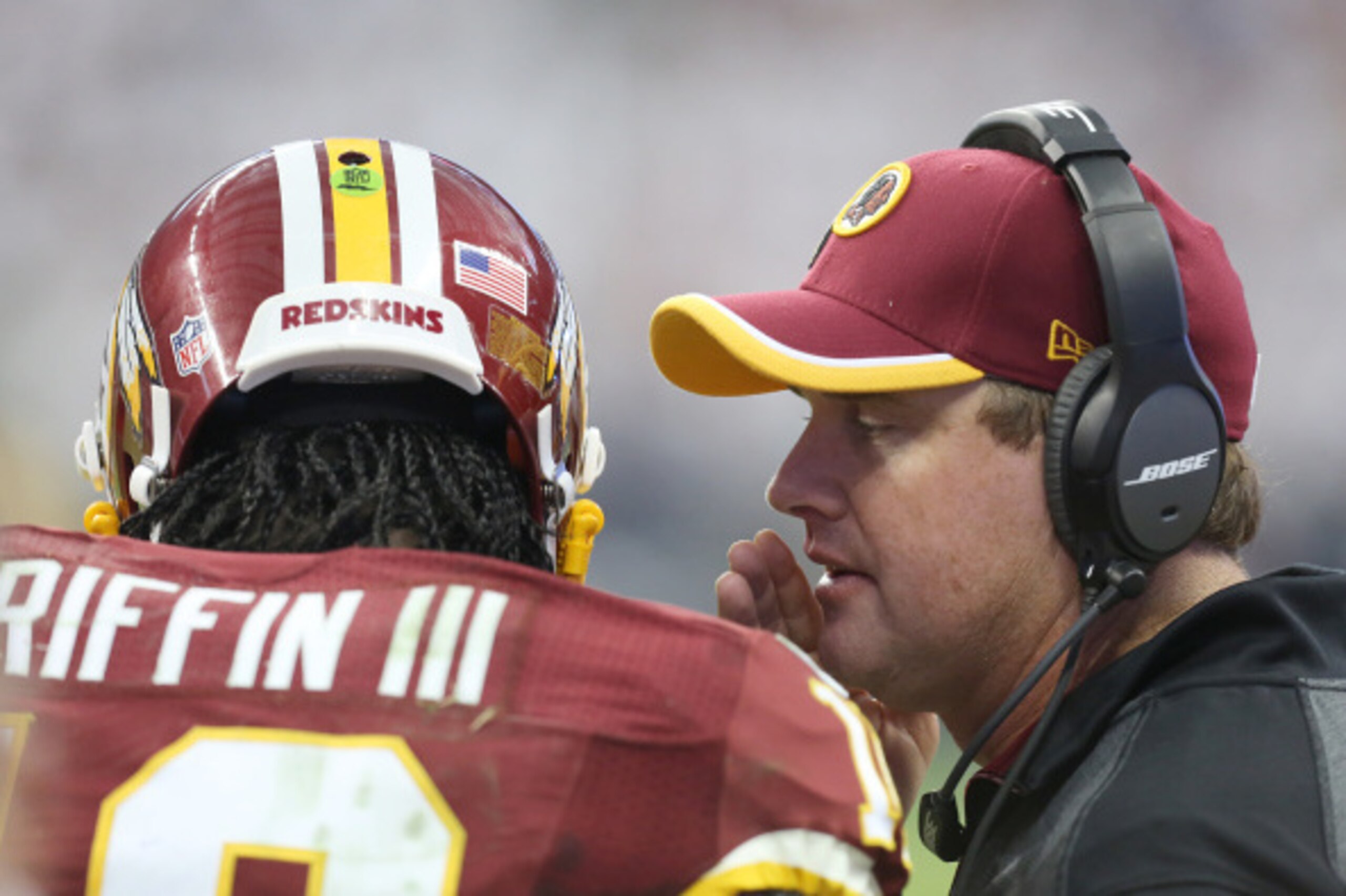HOUSTON, TX- SEPTEMBER 07: Washington Redskins head coach Jay Gruden gives Washington Redskins quarterback Robert Griffin III #10 the play in the third quarter against the Houston Texans on September 7, 2014 at NRG Stadium in Houston, Texas. (Photo by Tho