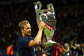 BERLIN, GERMANY - JUNE 06:  Ivan Rakitic of Barcelona holds the trophy as he celebrates victory after the UEFA Champions League Final between Juventus and FC Barcelona at Olympiastadion on June 6, 2015 in Berlin, Germany.  (Photo by Shaun Botterill/Getty 