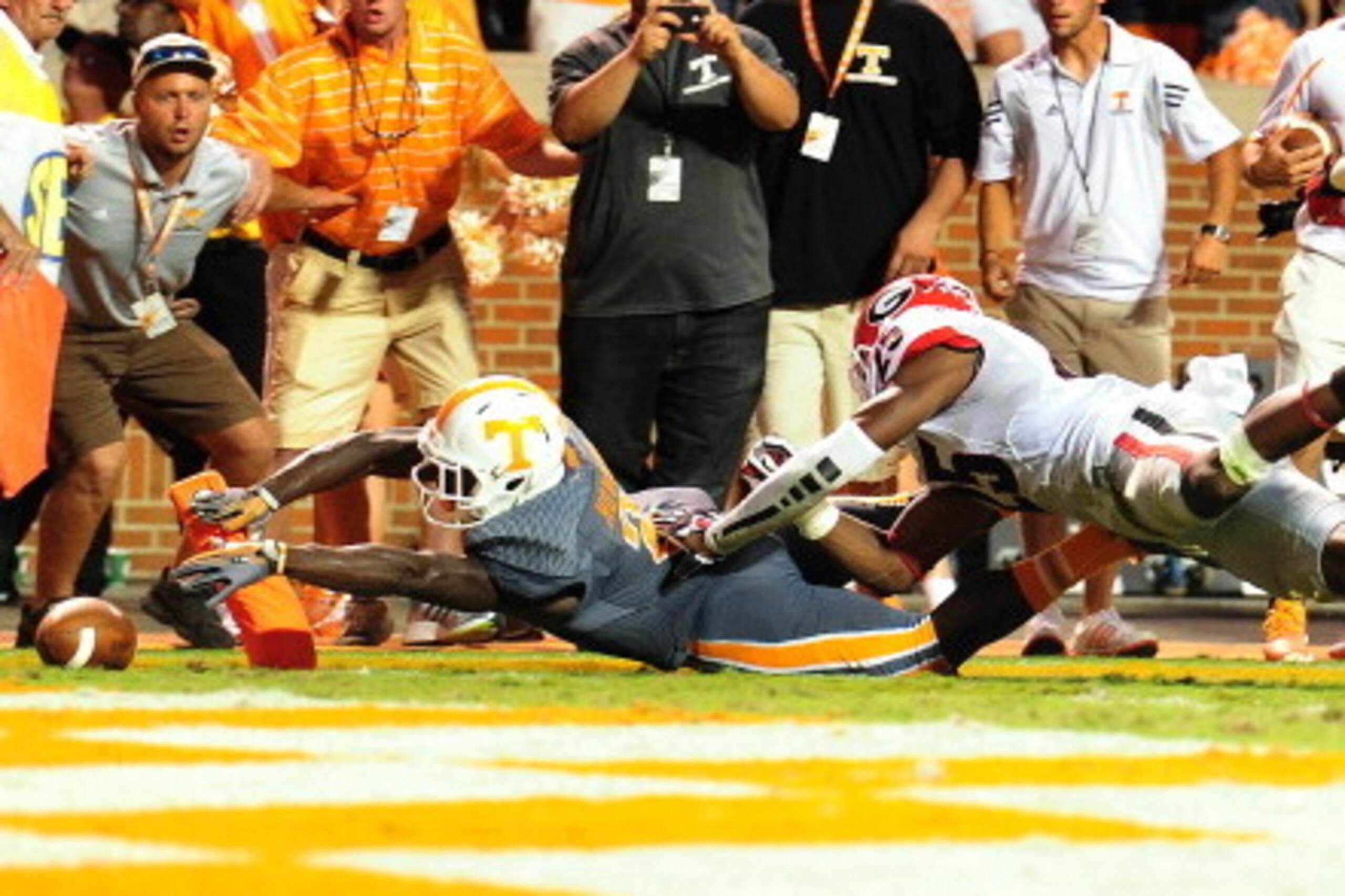 KNOXVILLE, TN - OCTOBER 5: Pig Howard #2 of the Tennessee Volunteers fumbles the ball through the end zone during overtime of the game against the Georgia Bulldogs at Neyland Stadium on October 5, 2013 in Knoxville, Tennessee. (Photo by Scott Cunningham/G