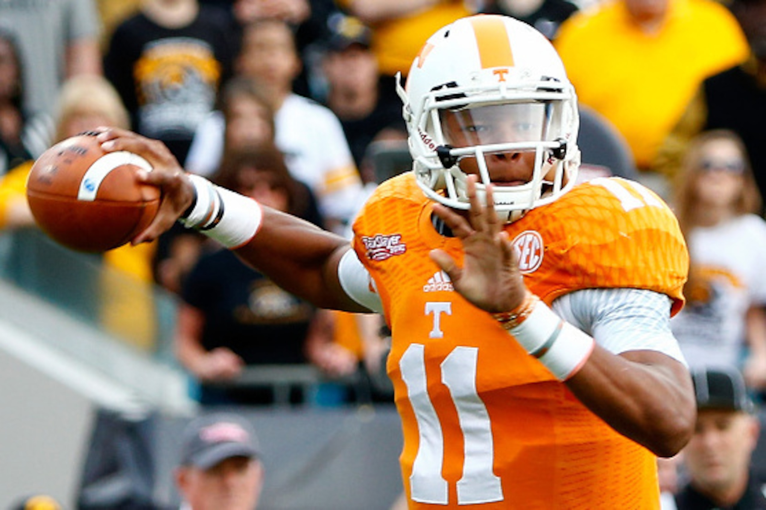 JACKSONVILLE, FL - JANUARY 02:  Joshua Dobbs #11 of the Tennessee Volunteers attempts a pass during the TaxSlayer Bowl against the Iowa Hawkeyes at EverBank Field on January 2, 2015 in Jacksonville, Florida.  (Photo by Sam Greenwood/Getty Images)