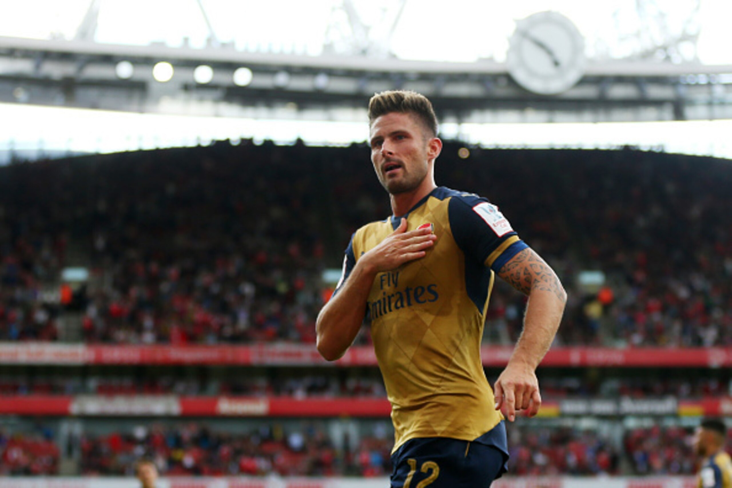 LONDON, ENGLAND - JULY 25: Olivier Giroud of Arsenal celebrates after he scores a goal to make it 1-0 during the Emirates Cup match between Arsenal and Olympique Lyonnais at Emirates Stadium on July 25, 2015 in London, England. (Photo by Catherine Ivill LONDON, ENGLAND - JULY 25: Olivier Giroud of Arsenal celebrates after he scores a goal to make it 1-0 during the Emirates Cup match between Arsenal and Olympique Lyonnais at Emirates Stadium on July 25, 2015 in London, England. (Photo by Catherine Ivill