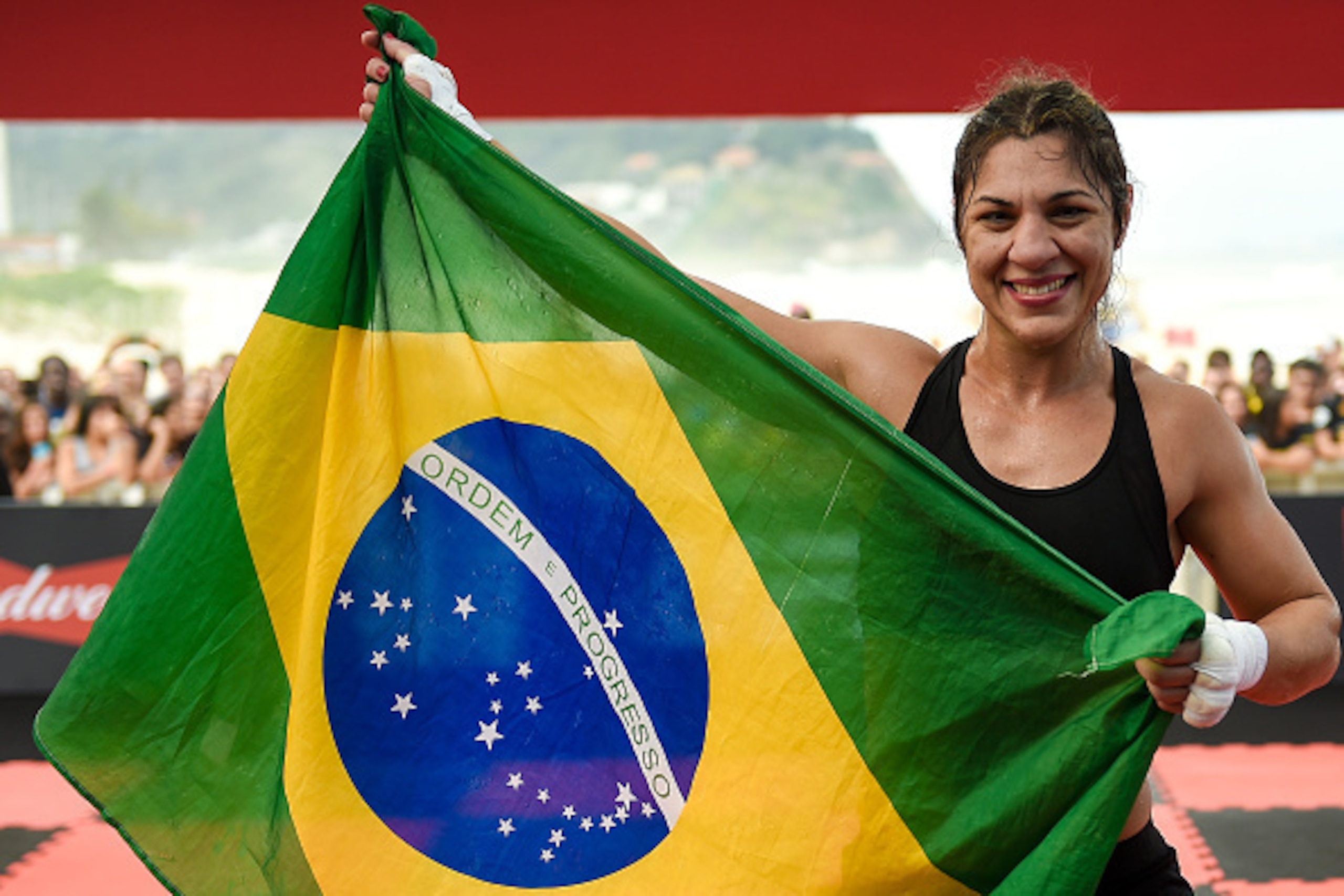 RIO DE JANEIRO, BRAZIL - JULY 29: Womens bantamweight contender Bethe Correia of Brazil poses with the flag of Brazil during open training session at Pepe Beach on July 29, 2015 in Rio de Janeiro, Brazil. (Photo by Buda Mendes/Zuffa LLC/Zuffa LLC via Ge RIO DE JANEIRO, BRAZIL - JULY 29: Womens bantamweight contender Bethe Correia of Brazil poses with the flag of Brazil during open training session at Pepe Beach on July 29, 2015 in Rio de Janeiro, Brazil. (Photo by Buda Mendes/Zuffa LLC/Zuffa LLC via Ge