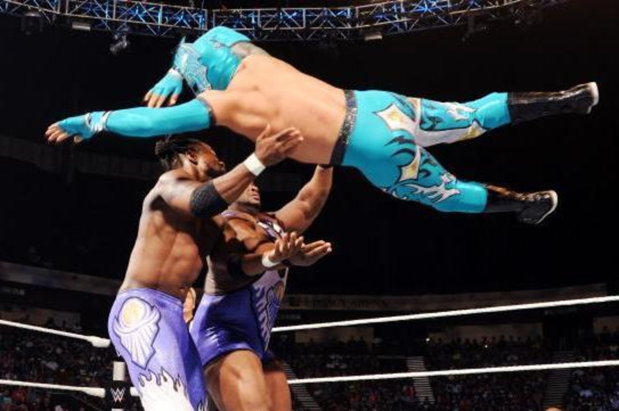 Kalisto dives at Kofi Kingston and Big E.