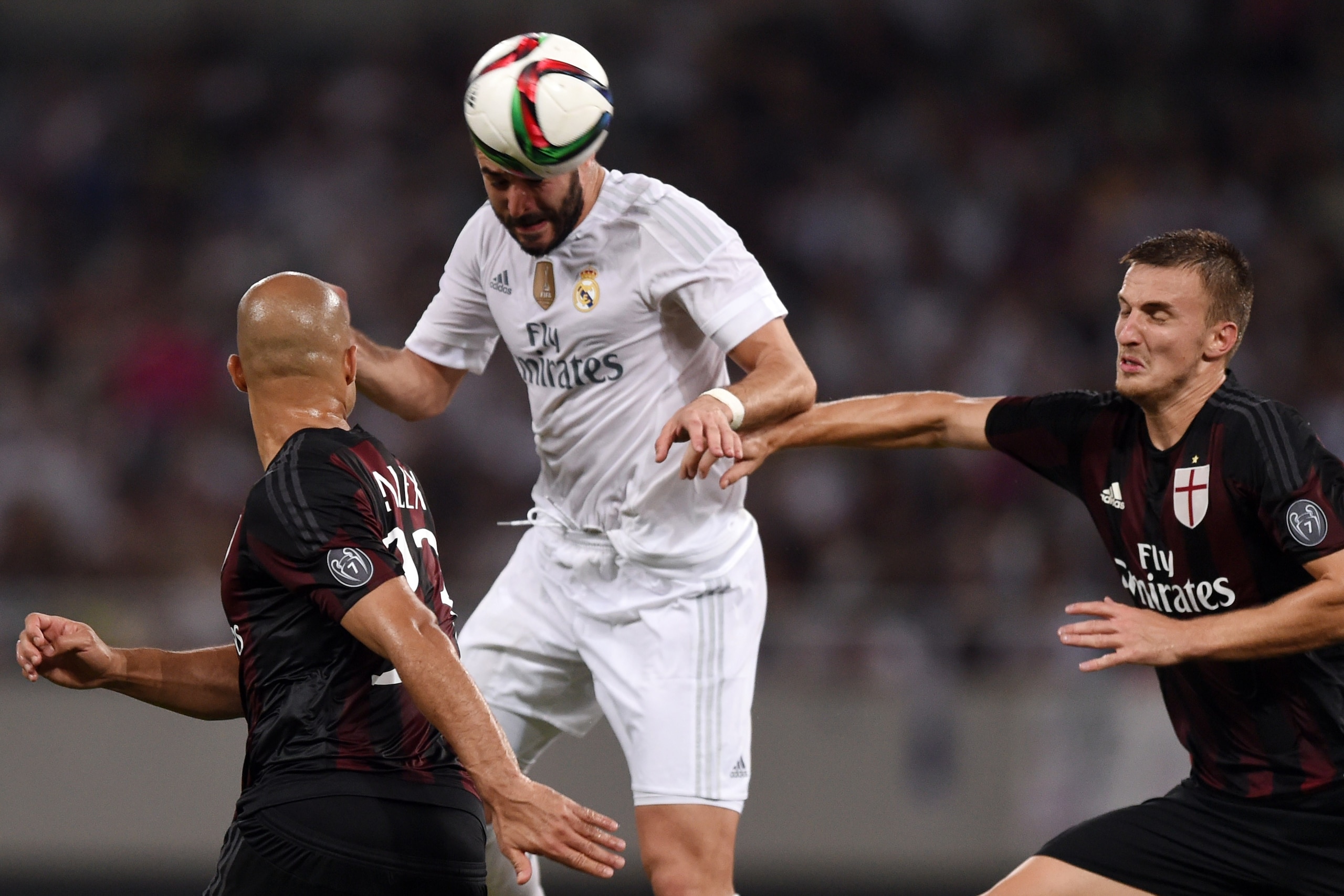 AC Milan's Brazilian defender Rodrigo Ely (R) and Real Madrid's Spanish defender ÃÂlvaro Arbeloa vie for the ball during the International Champions Cup football match between AC Milan and Real Madrid in Shanghai on July 30, 2015.   AFP PHOTO / JOHANNES E