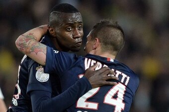 Paris Saint-Germain's midfielder Blaise Matuidi (L) celebrates with Paris Saint-Germain's Italian midfielder Marco Verratti after scoring a goal during the French L1 football match between Nantes and Paris Saint Germain on May 3, 2015 at the Beaujoire sta