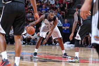 LAS VEGAS, NV - JULY 20:  Jonathan Simmons #16 of the San Antonio Spurs dribbles the ball against the Phoenix Suns during the Las Vegas Summer League Championship on July 20, 2015 at the Thomas & Mack Center in Las Vegas, Nevada. NOTE TO USER: User expres