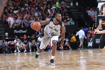 LAS VEGAS, NV - JULY 20:  Jonathan Simmons #16 of the San Antonio Spurs dribbles the ball against the Phoenix Suns during the Las Vegas Summer League Championship on July 20, 2015 at the Thomas & Mack Center in Las Vegas, Nevada. NOTE TO USER: User expres
