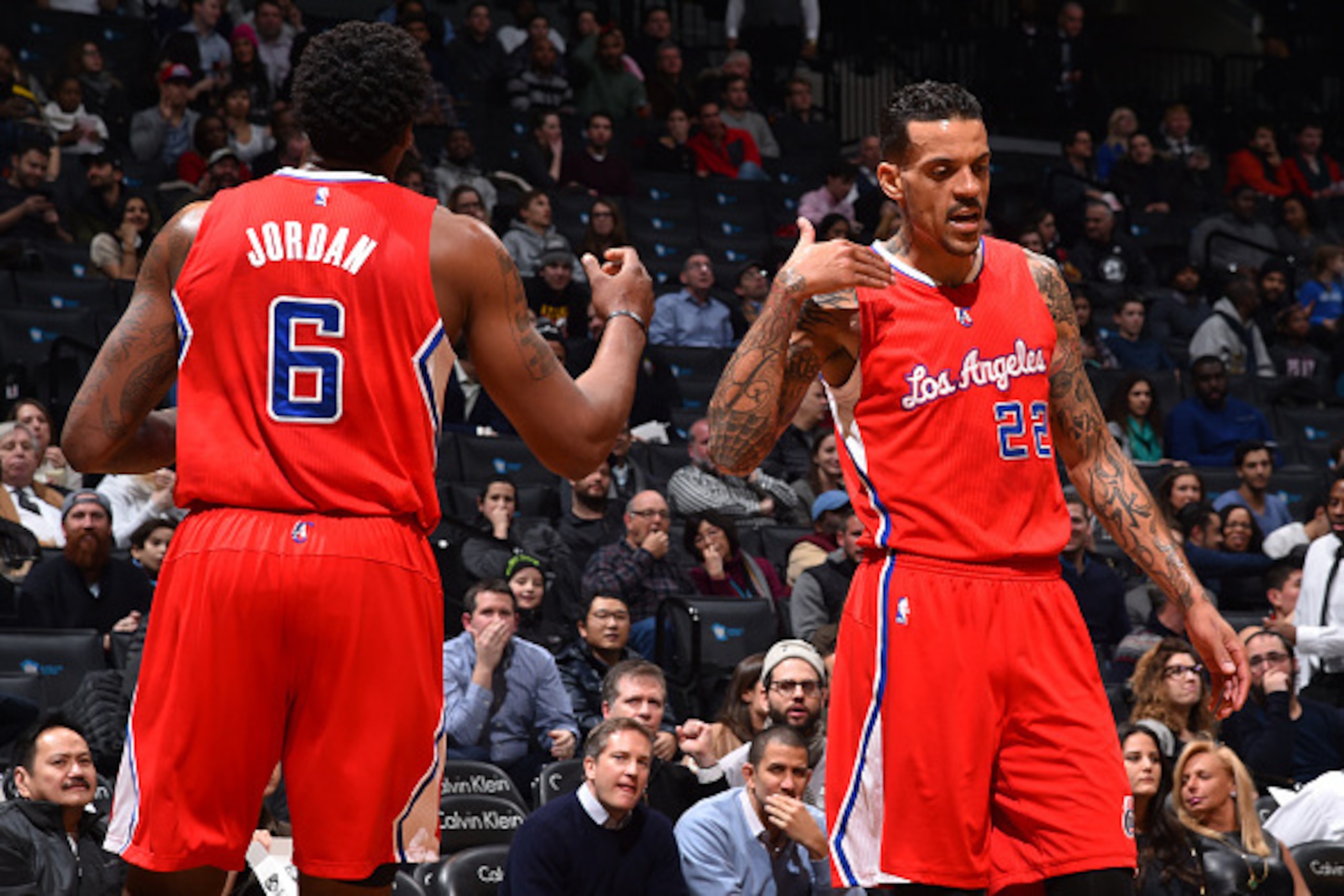 BROOKLYN, NY - FEBRUARY 2:DeAndre Jordan #6 and Matt Barnes #22 of the Los Angeles Clippers give eachother a high five against the Brooklyn Nets at the Barclays Center on February 2,2015 in Brooklyn, NY NOTE TO USER: User expressly acknowledges and agrees