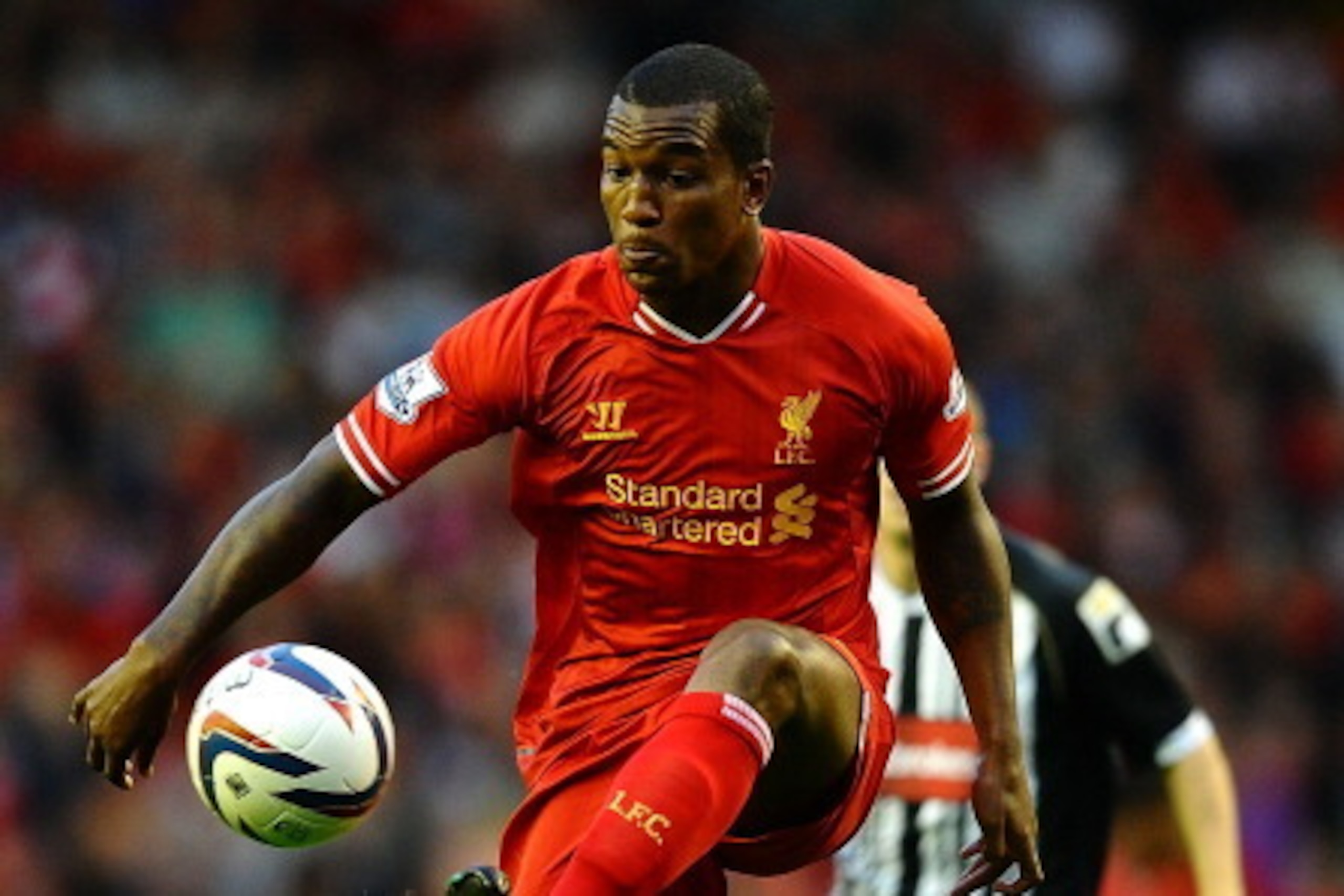 LIVERPOOL, ENGLAND - AUGUST 27:  Andre Wisdom of Liverpool in action during the Capital One Cup Second Round between Liverpool and Notts County at Anfield on August 27, 2013 in Liverpool, England.  (Photo by Laurence Griffiths/Getty Images)