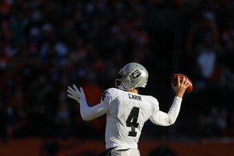 DENVER, CO - DECEMBER 28: Quarterback Derek Carr #4 of the Oakland Raiders in action against the Denver Broncos at Sports Authority Field at Mile High on December 28, 2014 in Denver, Colorado. (Photo by Justin Edmonds/Getty Images)