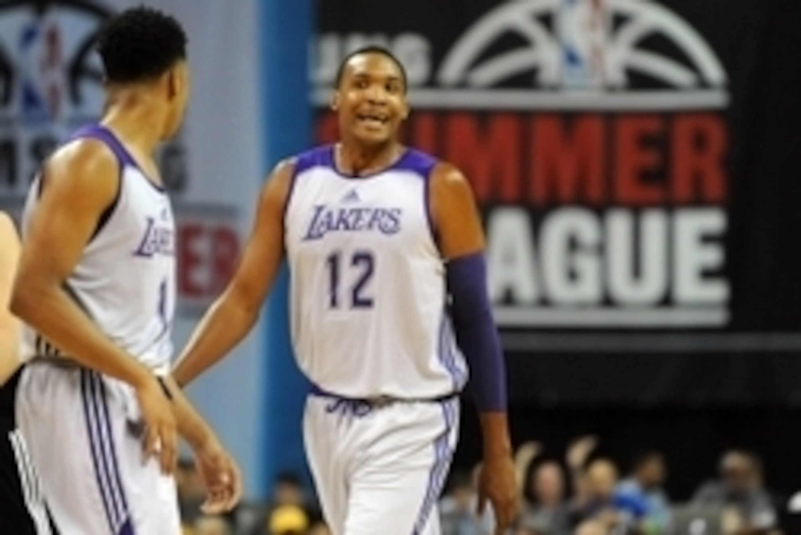 Jul 10, 2015; Las Vegas, NV, USA; Los Angeles Lakers center Robert Upshaw (12) reacts after a call during an NBA Summer League game against Minnesota at Thomas & Mack Center. Minnesota won the game 81-68.  Mandatory Credit: Stephen R. Sylvanie-USA TODAY S