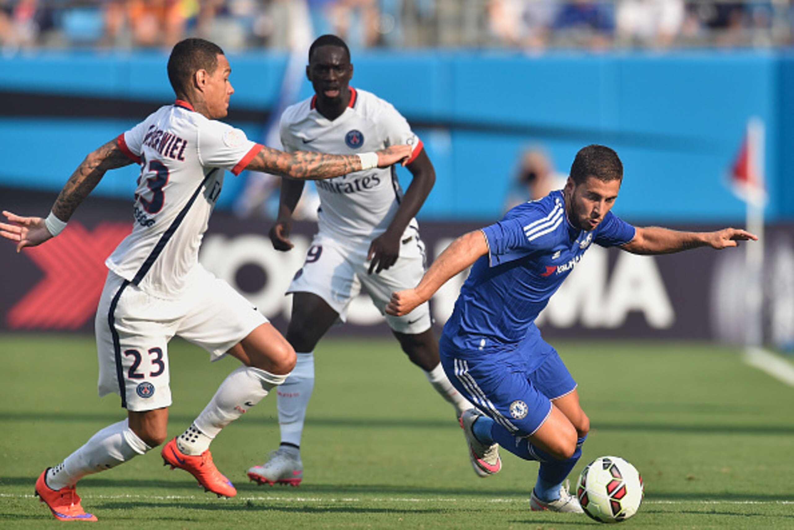 CHARLOTTE, NC - JULY 25:  Eden Hazard #10 of Chelsea moves the ball against Gregory van der Wiel #23 and Jean-Kevin Augustin #29 of Paris Saint-Germain during their International Champions Cup match at Bank of America Stadium on July 25, 2015 in Charlotte