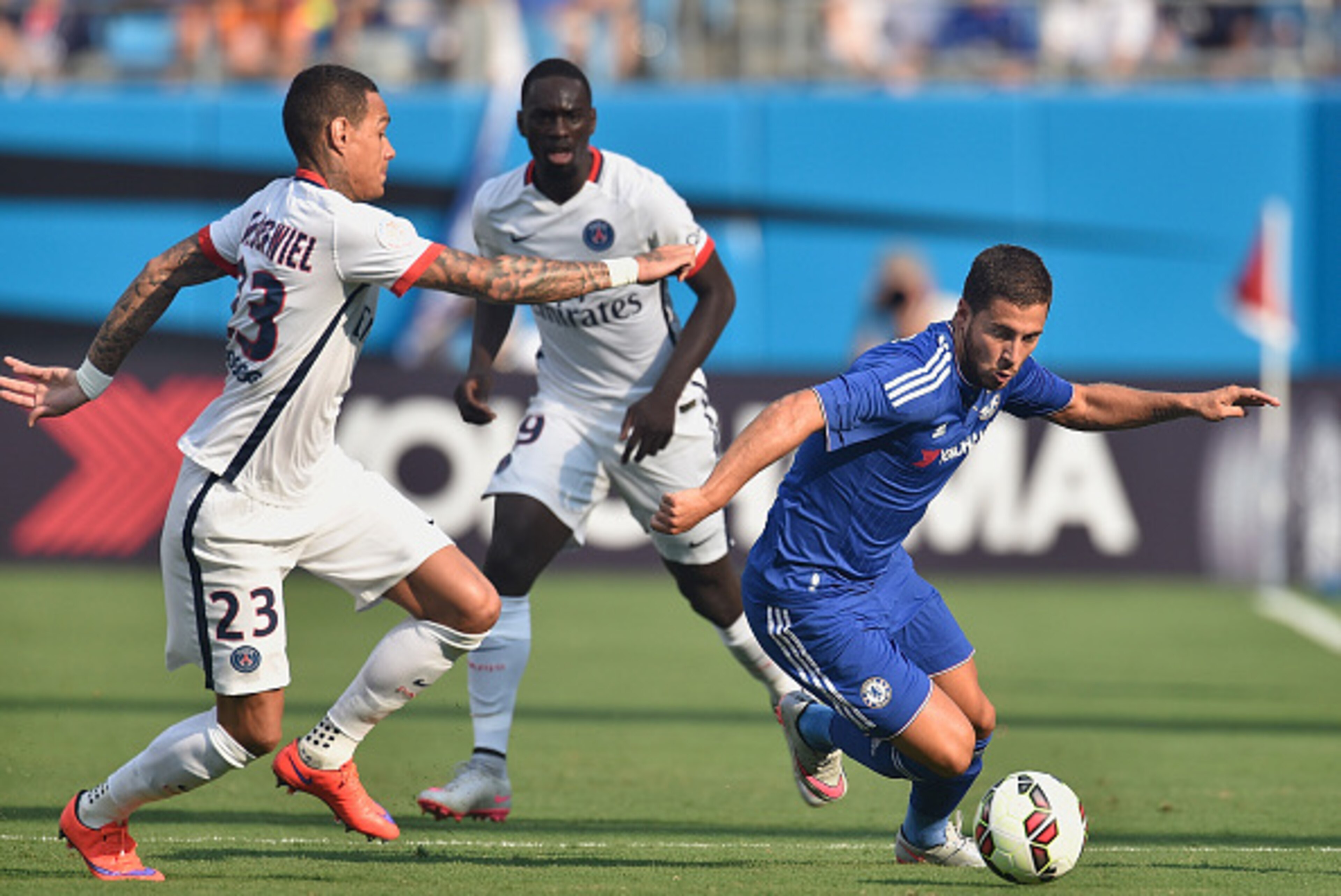CHARLOTTE, NC - JULY 25:  Eden Hazard #10 of Chelsea moves the ball against Gregory van der Wiel #23 and Jean-Kevin Augustin #29 of Paris Saint-Germain during their International Champions Cup match at Bank of America Stadium on July 25, 2015 in Charlotte