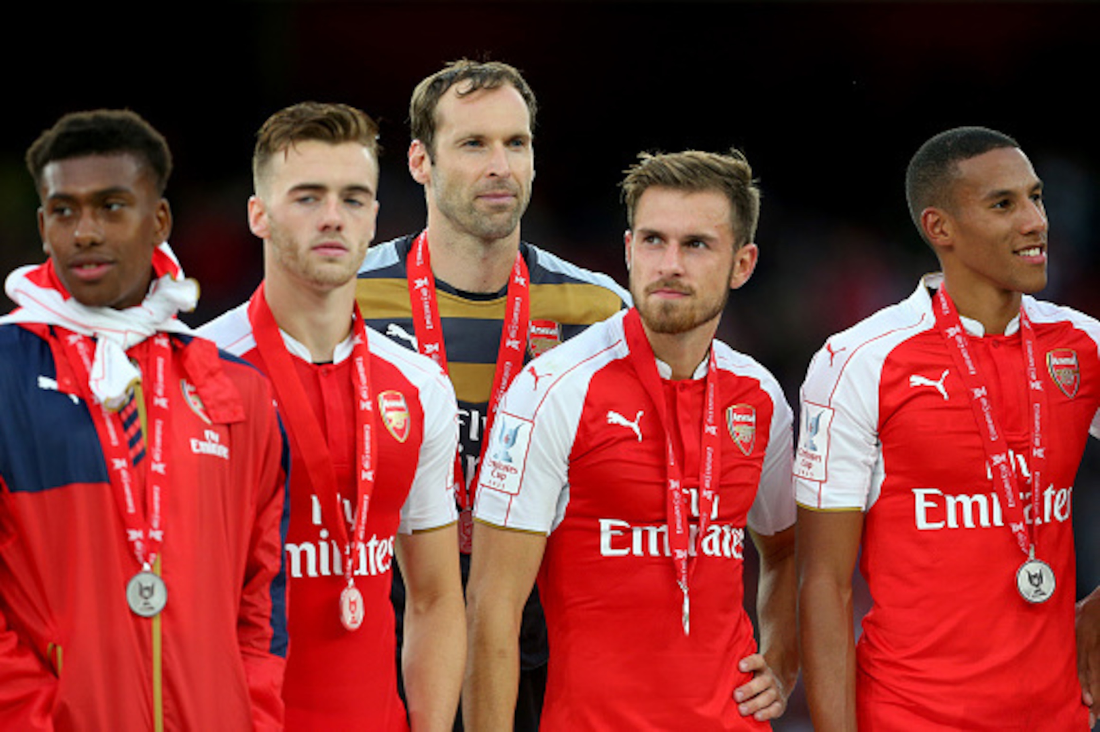 LONDON, ENGLAND - JULY 26:  Petr Cech of Arsenal stands with his team mates Alex Iwobi, Calum Chambers, Aaron Ramsey and Isaac Hayden of Arsenal after the Emirates Cup match between Arsenal and VfL Wolfsburg at Emirates Stadium on July 26, 2015 in London,