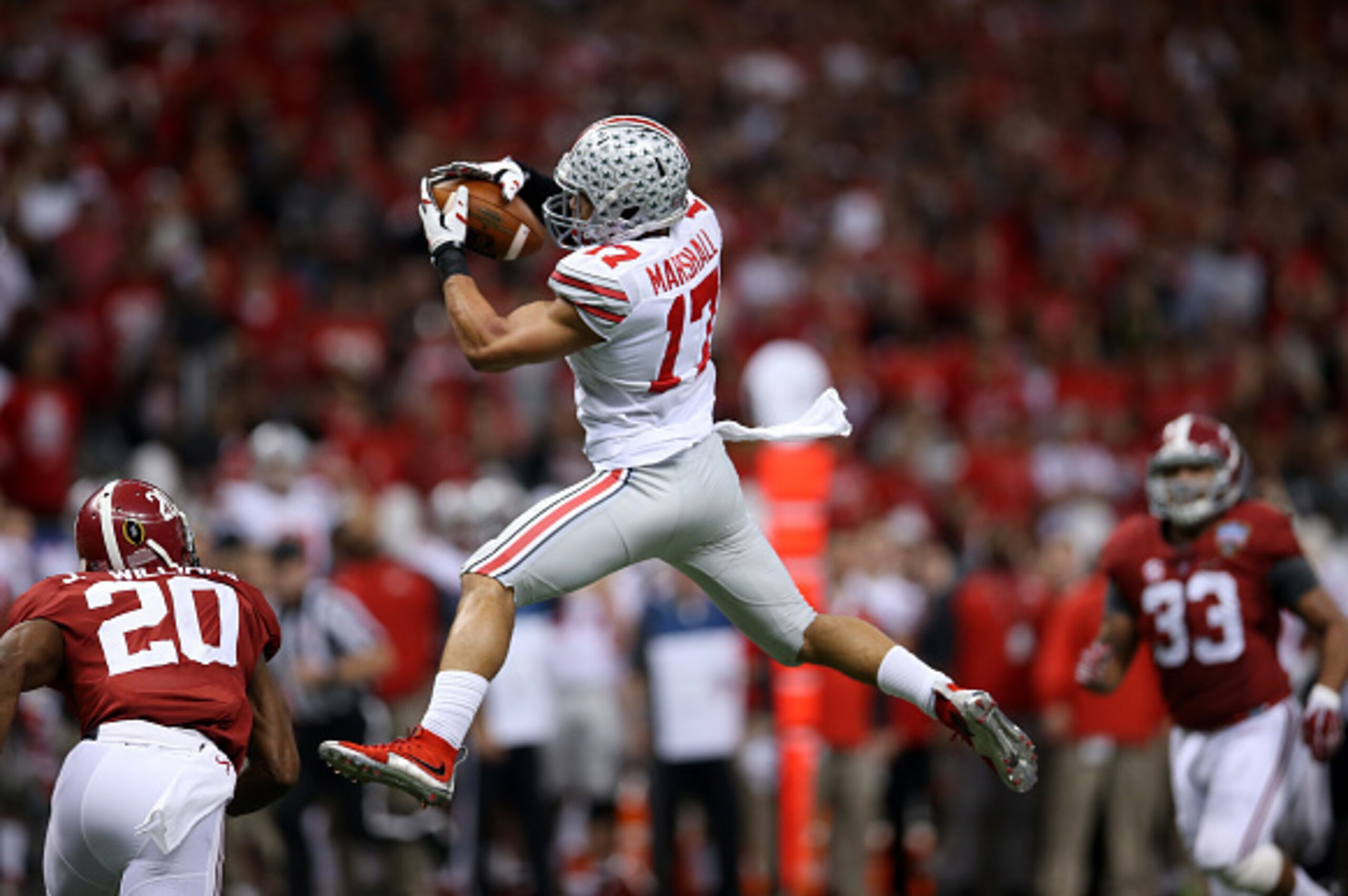NEW ORLEANS, LA - JANUARY 01: Jalin Marshall #17 of the Ohio State Buckeyes makes a catch over Jarrick Williams #20 of the Alabama Crimson Tide during the All State Sugar Bowl at the Mercedes-Benz Superdome on January 1, 2015 in New Orleans, Louisiana. NEW ORLEANS, LA - JANUARY 01: Jalin Marshall #17 of the Ohio State Buckeyes makes a catch over Jarrick Williams #20 of the Alabama Crimson Tide during the All State Sugar Bowl at the Mercedes-Benz Superdome on January 1, 2015 in New Orleans, Louisiana.