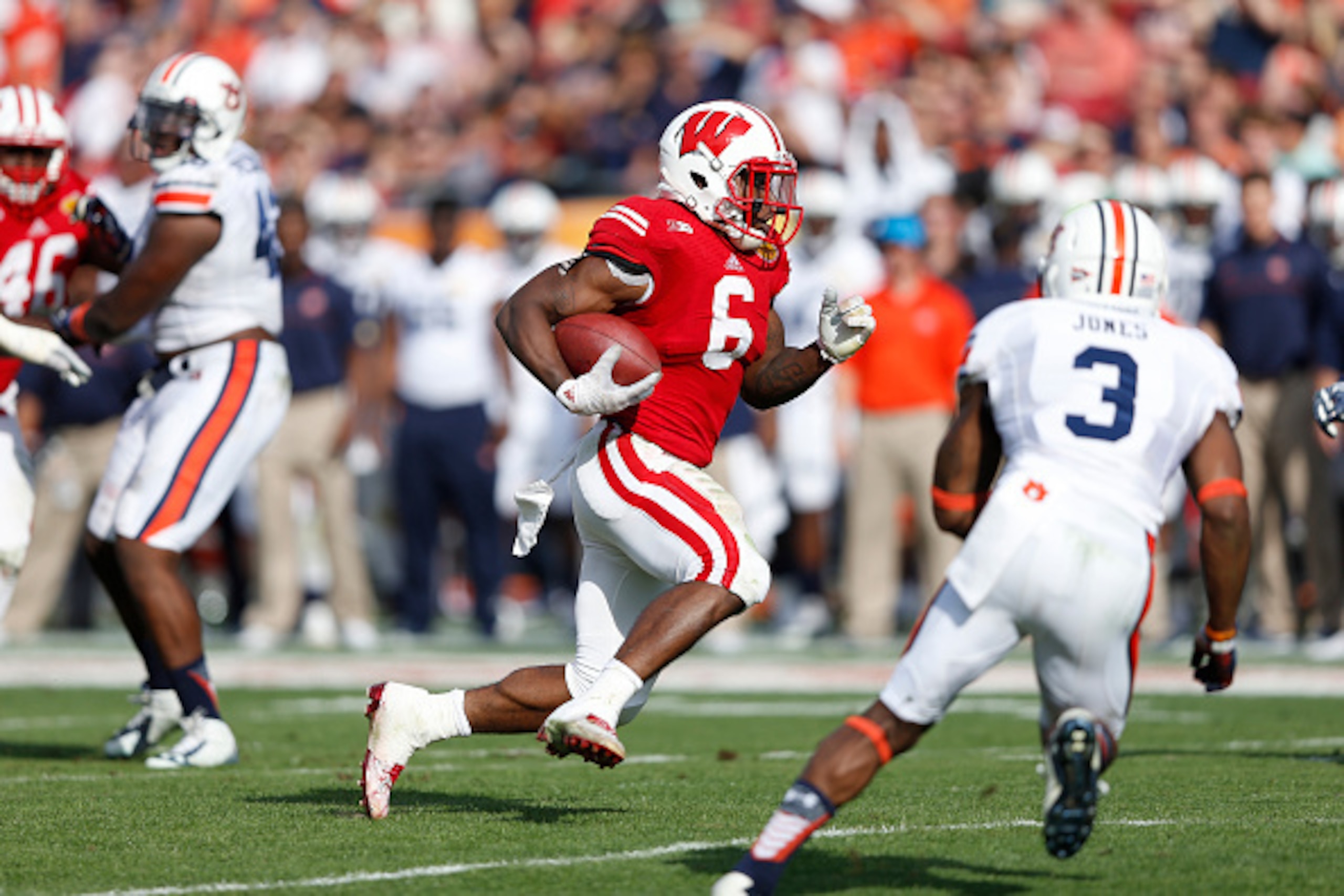 TAMPA, FL - JANUARY 1: Corey Clement #6 of the Wisconsin Badgers runs with the ball against the Auburn Tigers during the Outback Bowl at Raymond James Stadium on January 1, 2015 in Tampa, Florida. Wisconsin defeated Auburn 34-31 in overtime. (Photo by Joe TAMPA, FL - JANUARY 1: Corey Clement #6 of the Wisconsin Badgers runs with the ball against the Auburn Tigers during the Outback Bowl at Raymond James Stadium on January 1, 2015 in Tampa, Florida. Wisconsin defeated Auburn 34-31 in overtime. (Photo by Joe