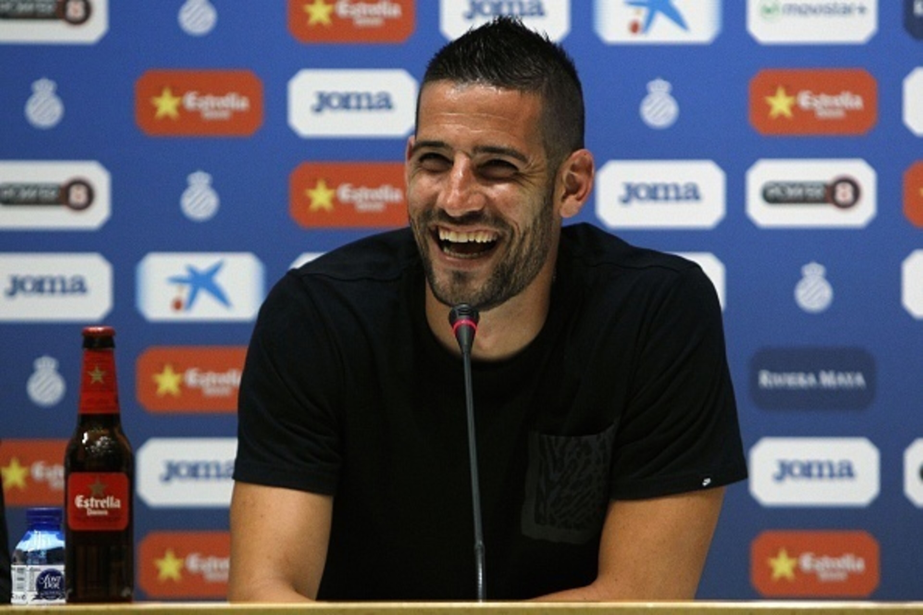 Espanyol's Spanish goalkeeper Kiko Casilla laughs during a press conference at the Power8 stadium in Cornella de Llobregat on July 17, 2015. The Catalan club announced today that Casilla signed a 6 millions euros (6,5 millions dollars) contract with Real 