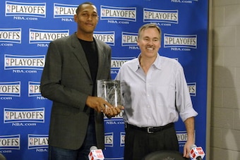 PHOENIX - MAY 1:  Boris Diaw #12 of the Phoenix Suns is presented the 2005-06 NBA Most Improved Player Award by Mike D'Antoni, Head Coach of the Phoenix Suns, during a press conference on May 1, 2006 at U.S. Airways Center in Phoenix, Arizona.  NOTE TO US