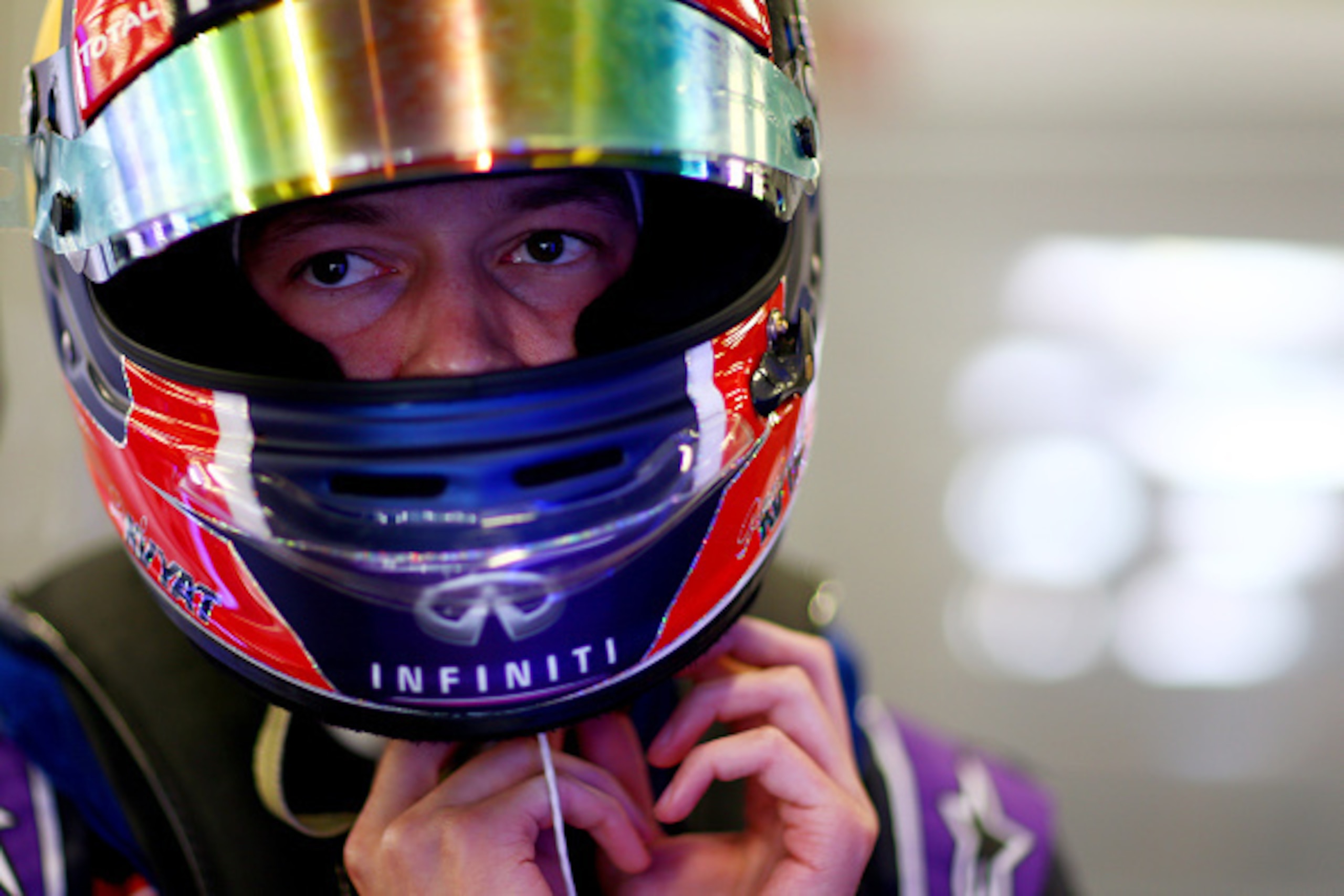 NORTHAMPTON, ENGLAND - JULY 03: Daniil Kvyat of Russia and Infiniti Red Bull Racing prepares in the garage during practice for the Formula One Grand Prix of Great Britain at Silverstone Circuit on July 3, 2015 in Northampton, England. (Photo by Dan Isti NORTHAMPTON, ENGLAND - JULY 03: Daniil Kvyat of Russia and Infiniti Red Bull Racing prepares in the garage during practice for the Formula One Grand Prix of Great Britain at Silverstone Circuit on July 3, 2015 in Northampton, England. (Photo by Dan Isti