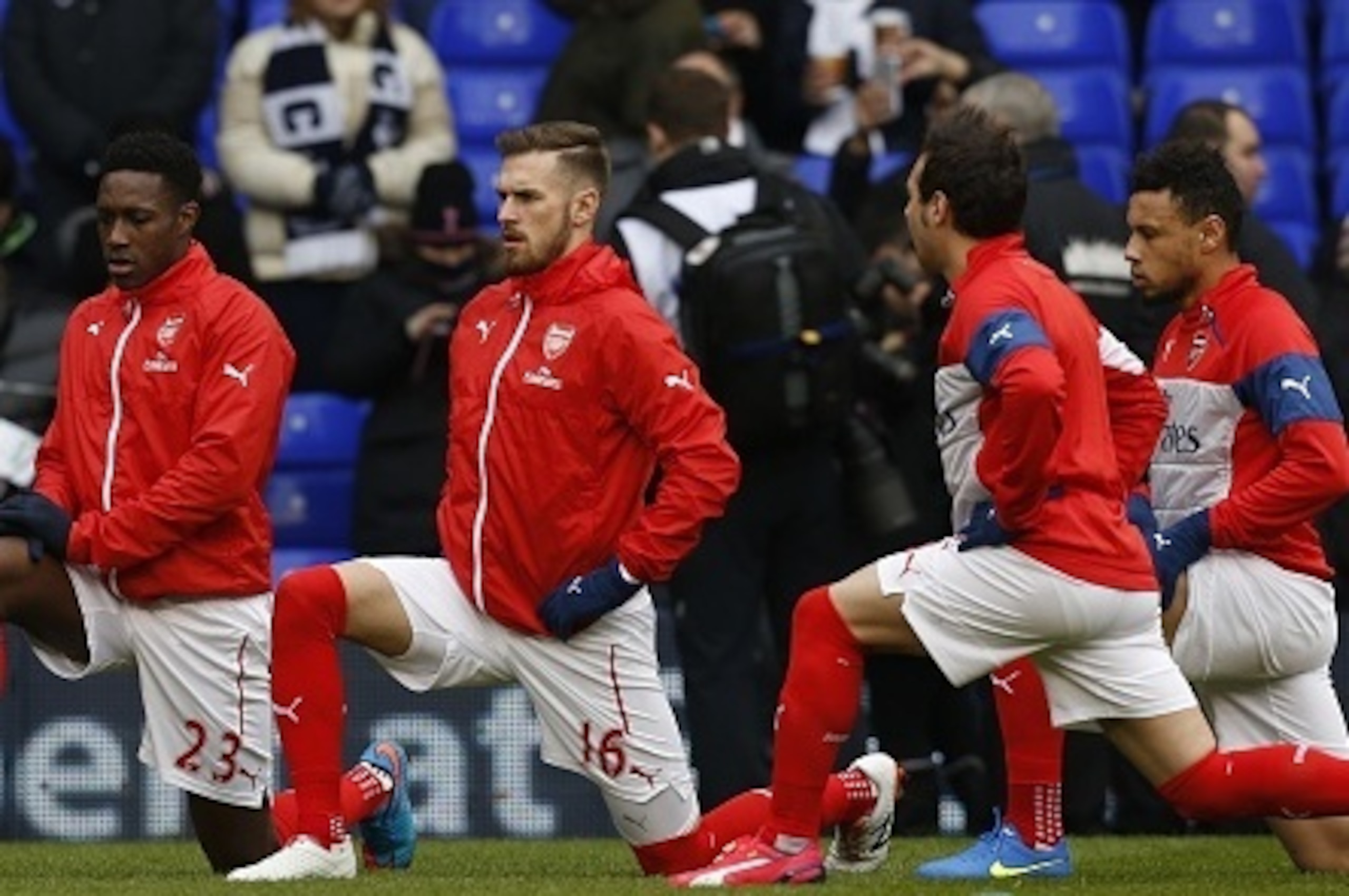 (L-R) Arsenal's English striker Danny Welbeck, Arsenal's Welsh midfielder Aaron Ramsey, Arsenal's Spanish midfielder Santi Cazorla and Arsenal's French midfielder Francis Coquelin warm up before kick off of the English Premier League football match betwee