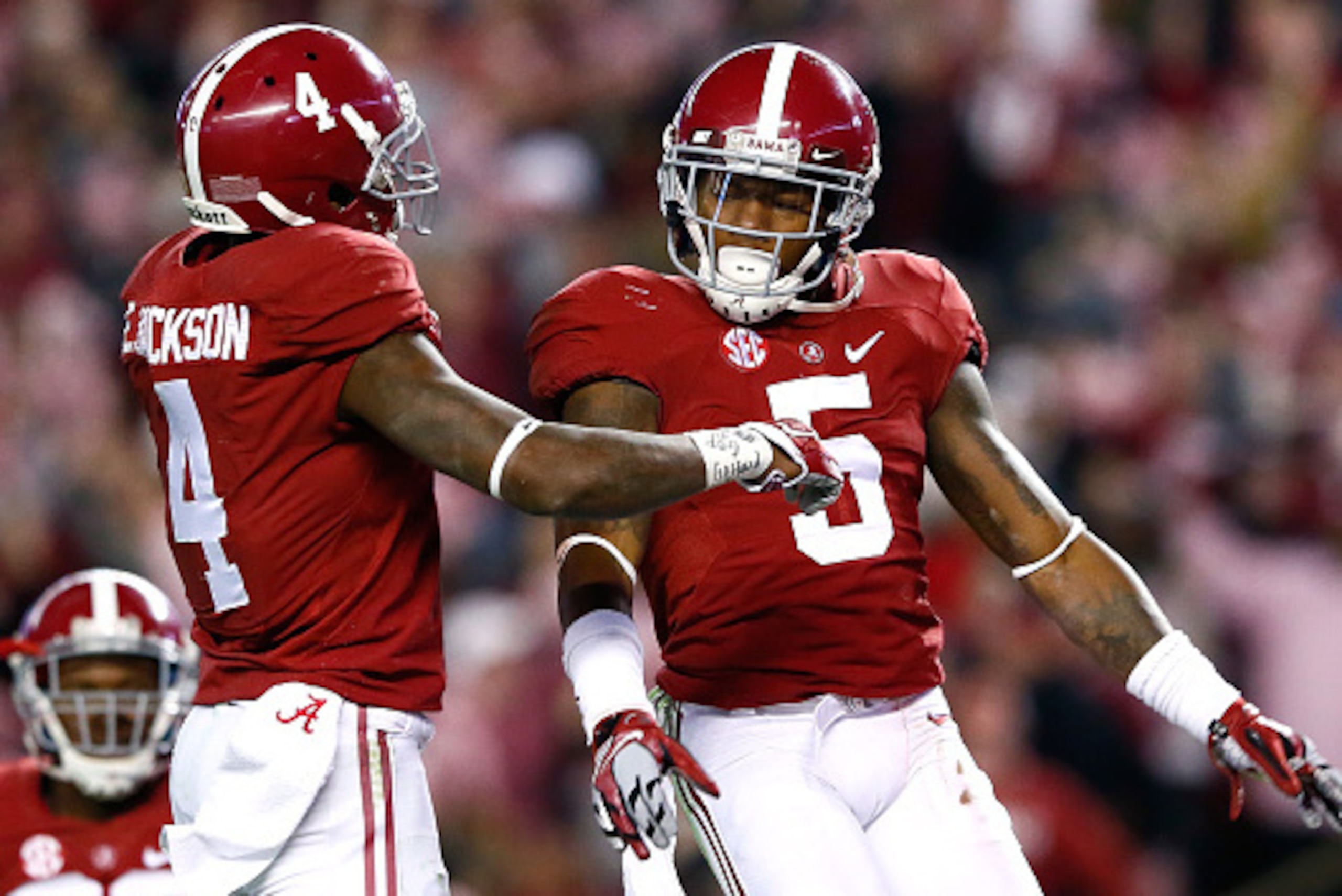 TUSCALOOSA, AL - NOVEMBER 15:  Cyrus Jones #5 of the Alabama Crimson Tide reacts after intercepting a touchdown reception intended for De'Runnya Wilson #1 of the Mississippi State Bulldogs with Eddie Jackson #4 at Bryant-Denny Stadium on November 15, 2014