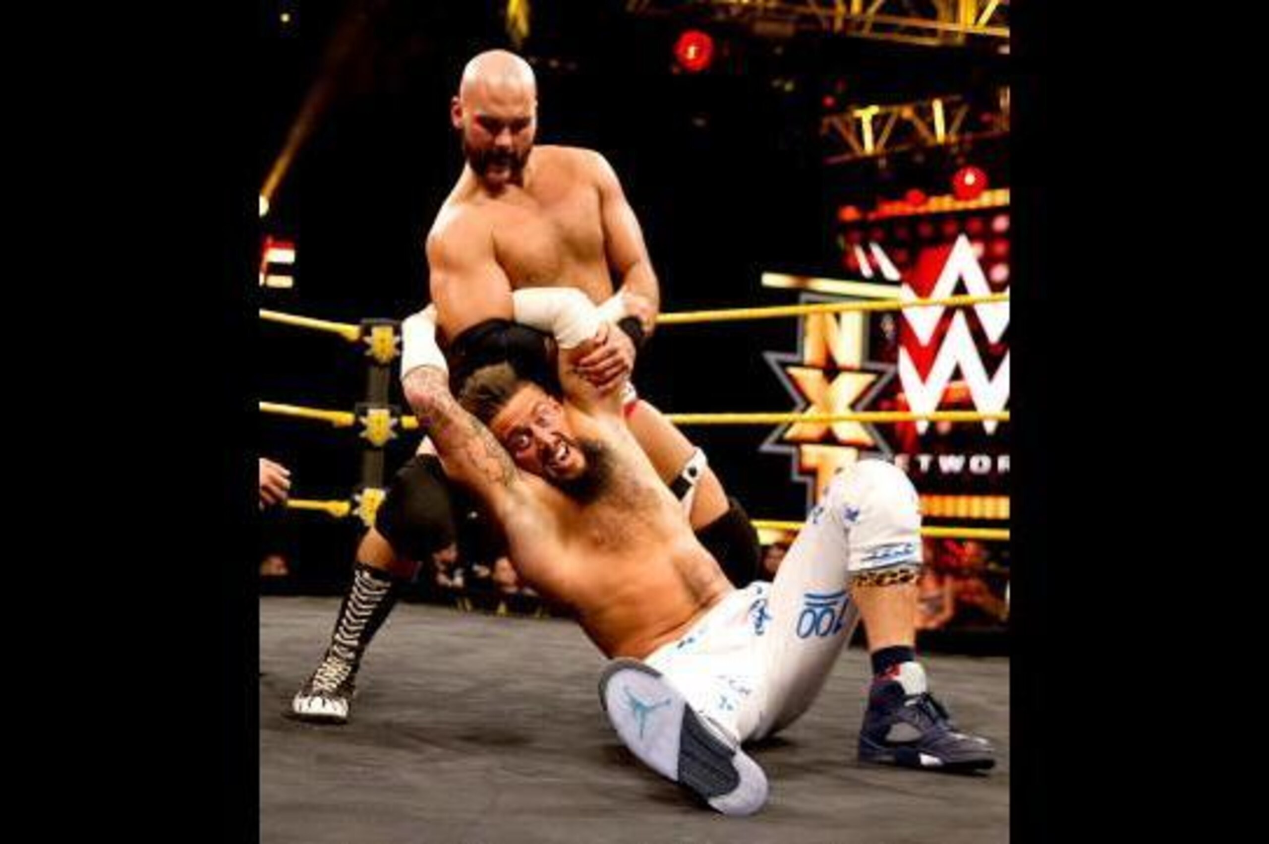 Scott Dawson grounds Enzo Amore.