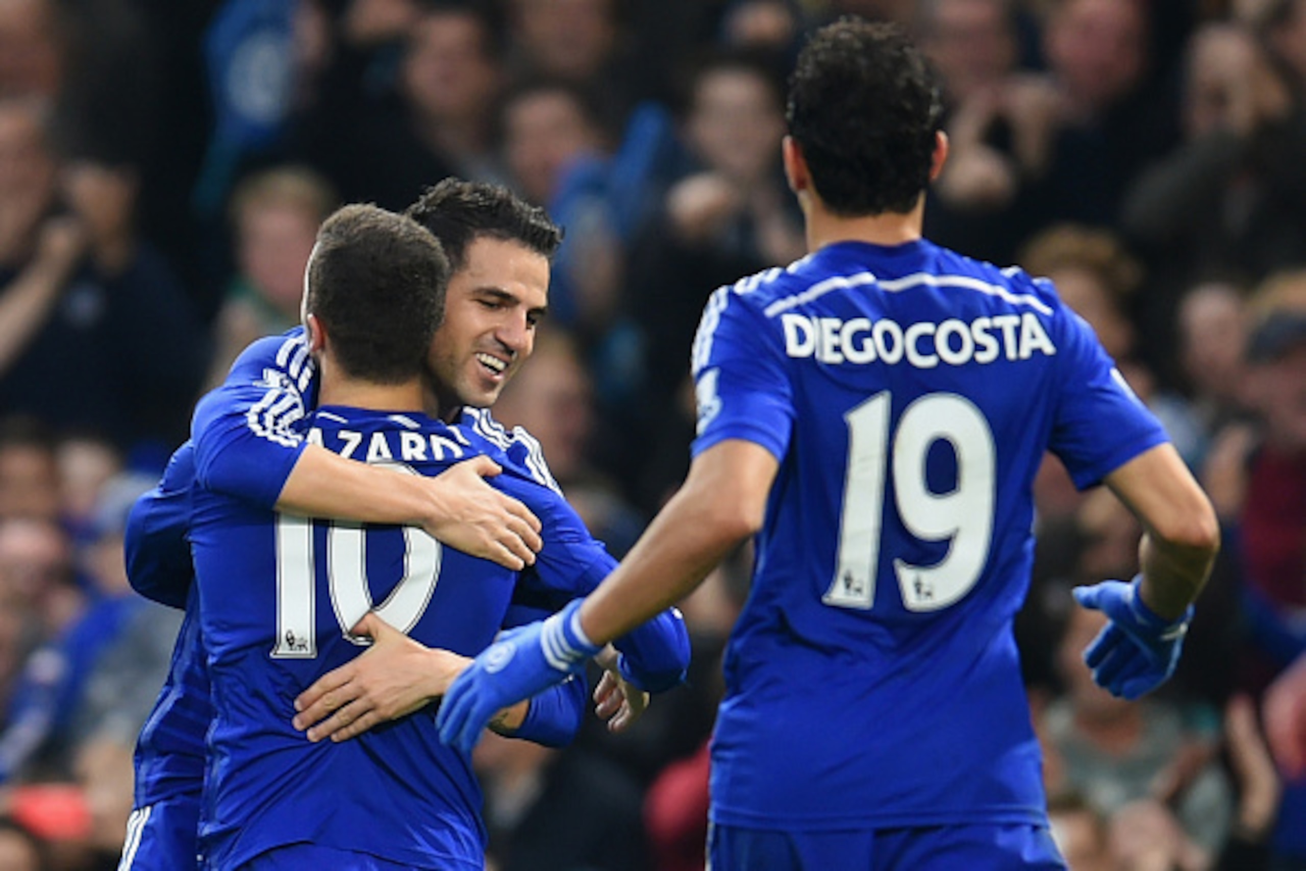 LONDON, ENGLAND - NOVEMBER 22:  Cesc Fabregas of Chelsea hugs Eden Hazard of Chelsea after he scored their second goal during the Barclays Premier League match between Chelsea and West Bromwich Albion at Stamford Bridge on November 22, 2014 in London, Eng