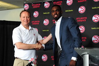 ATLANTA, GA - JUNE 29:  Mike Budenholzer of the Atlanta Hawks introduces Tim Hardaway Jr. as a new member of the team during a press conference on June 29, 2015 at Philips Arena in Atlanta, Georgia.  NOTE TO USER: User expressly acknowledges and agrees th