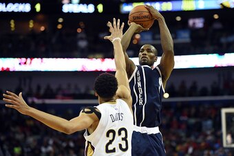 NEW ORLEANS, LA - FEBRUARY 04: Serge Ibaka #9 of the Oklahoma City Thunder shoots over Anthony Davis #23 of the New Orleans Pelicans during the second half of a game at the Smoothie King Center on February 4, 2015 in New Orleans, Louisiana. NOTE TO USER: 