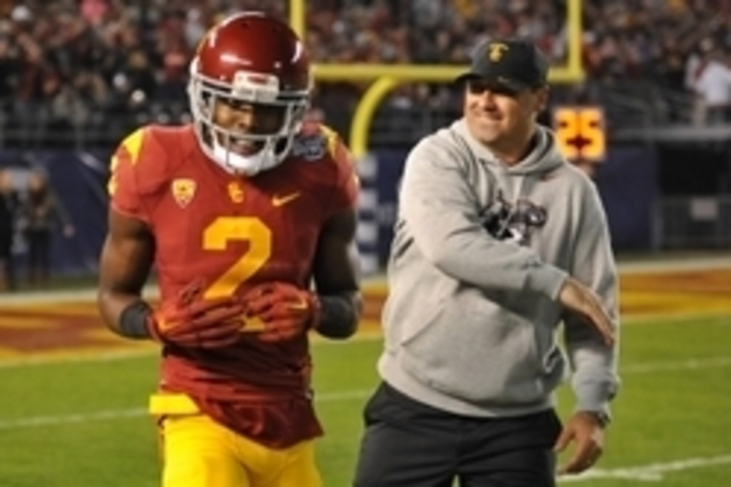 Dec 27, 2014; San Diego, CA, USA; USC Trojans head coach Steve Sarkisian (R) congratulates cornerback Adoree' Jackson (2) after scoring a touchdown during the first quarter against the Nebraska Cornhuskers in the 2014 Holiday Bowl at Qualcomm Stadium. Man
