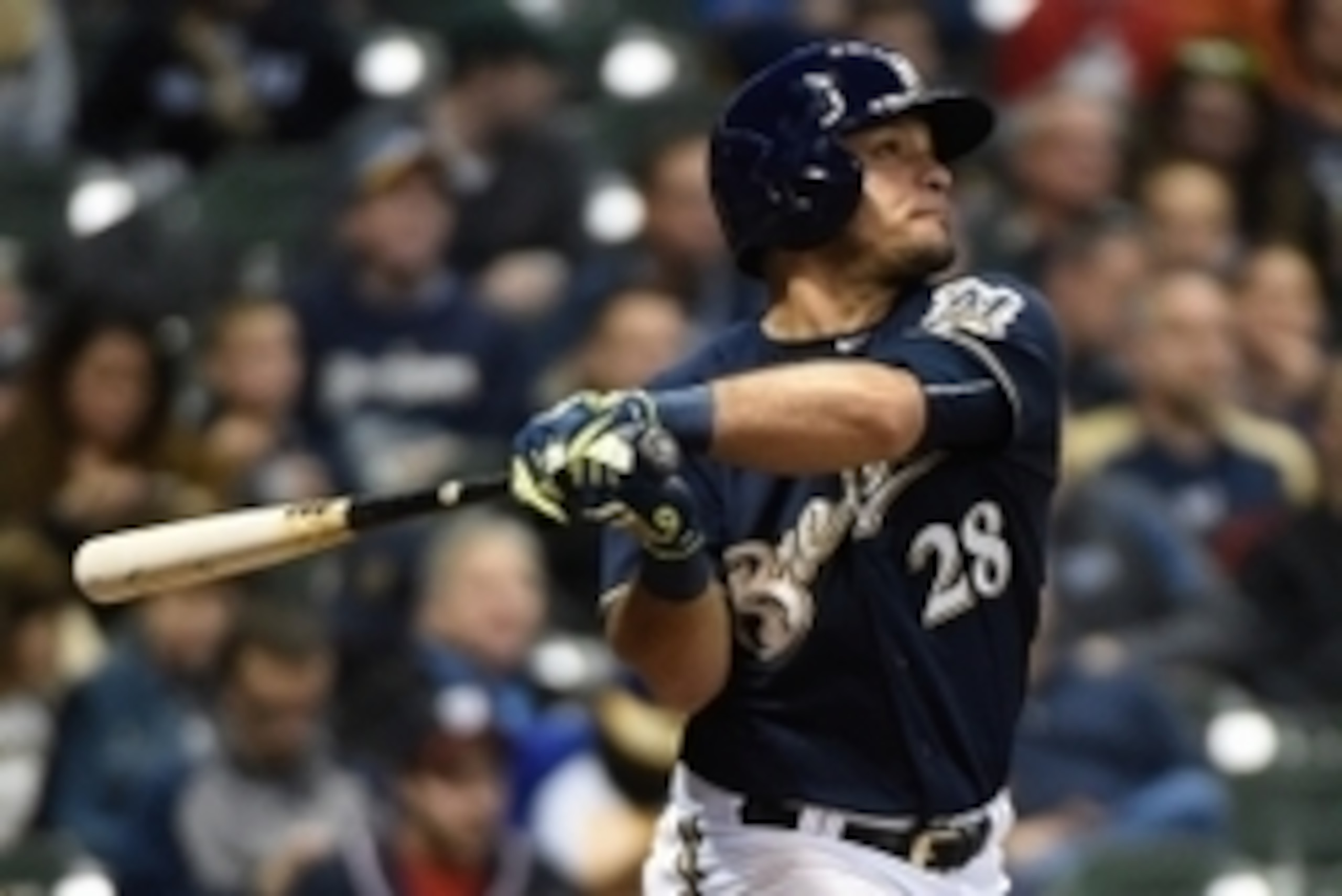 Jun 11, 2015; Milwaukee, WI, USA; Milwaukee Brewers center fielder Gerardo Parra (28) hits a solo home run in the seventh inning against the Washington Nationals at Miller Park. Mandatory Credit: Benny Sieu-USA TODAY Sports