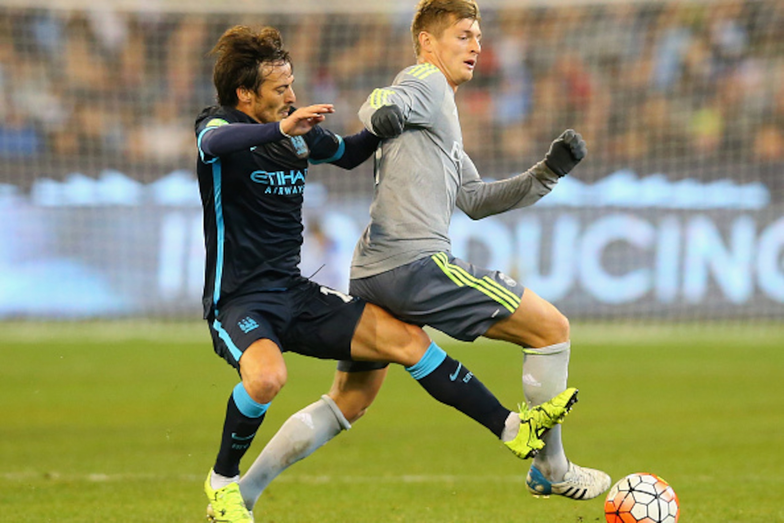 MELBOURNE, AUSTRALIA - JULY 24:  David Silva of Manchester City and Toni Kroos of Real Madrid compete for the ball during the International Champions Cup match between Real Madrid and Manchester City at Melbourne Cricket Ground on July 24, 2015 in Melbour