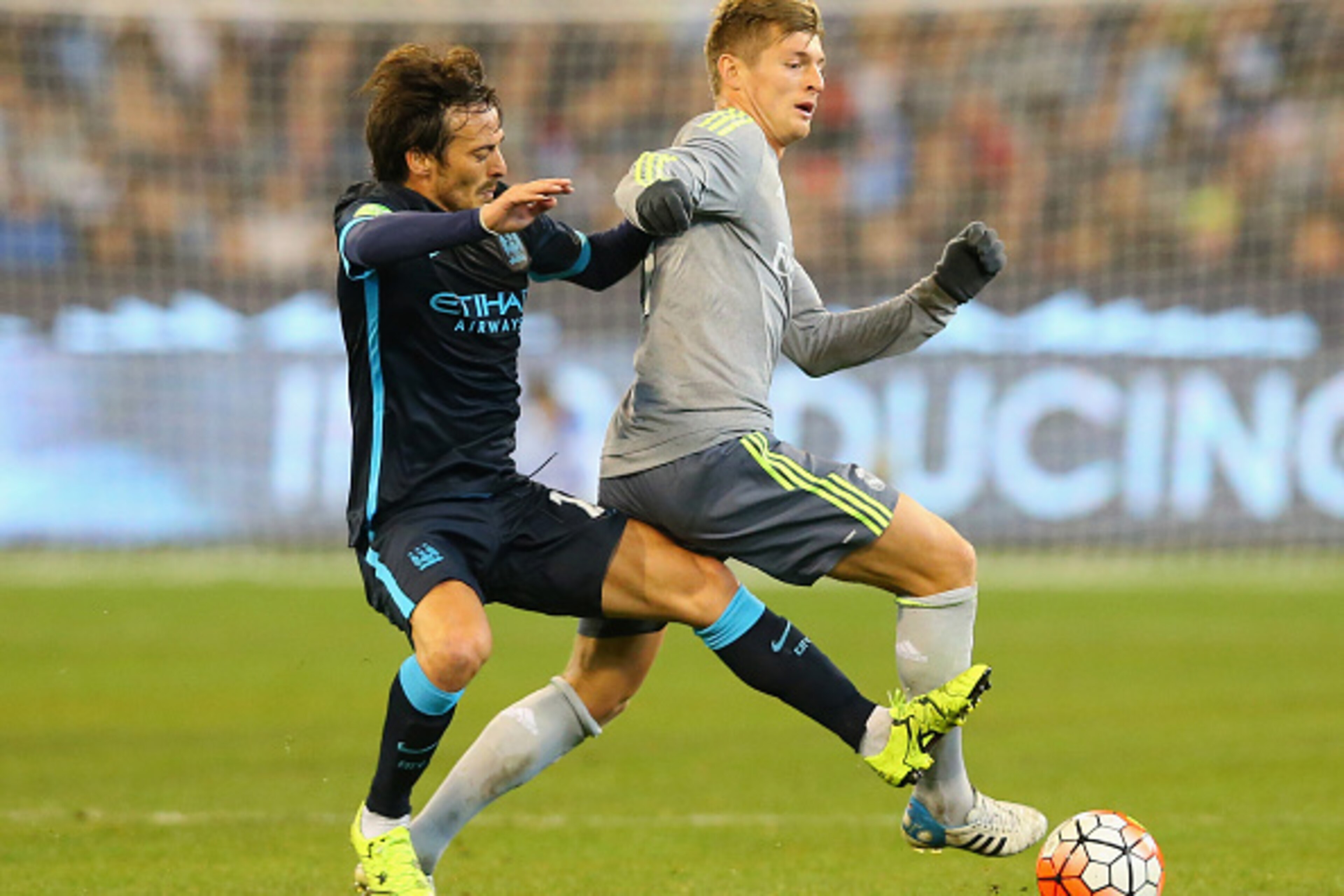 MELBOURNE, AUSTRALIA - JULY 24:  David Silva of Manchester City and Toni Kroos of Real Madrid compete for the ball during the International Champions Cup match between Real Madrid and Manchester City at Melbourne Cricket Ground on July 24, 2015 in Melbour