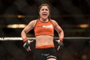 August 30, 2014; Sacramento, CA, USA; Bethe Correia (red gloves) defeats Shayna Baszler (blue gloves) during the women   s bantamweight bout of UFC 177 at Sleep Train Arena. Mandatory Credit: Kyle Terada-USA TODAY Sports
