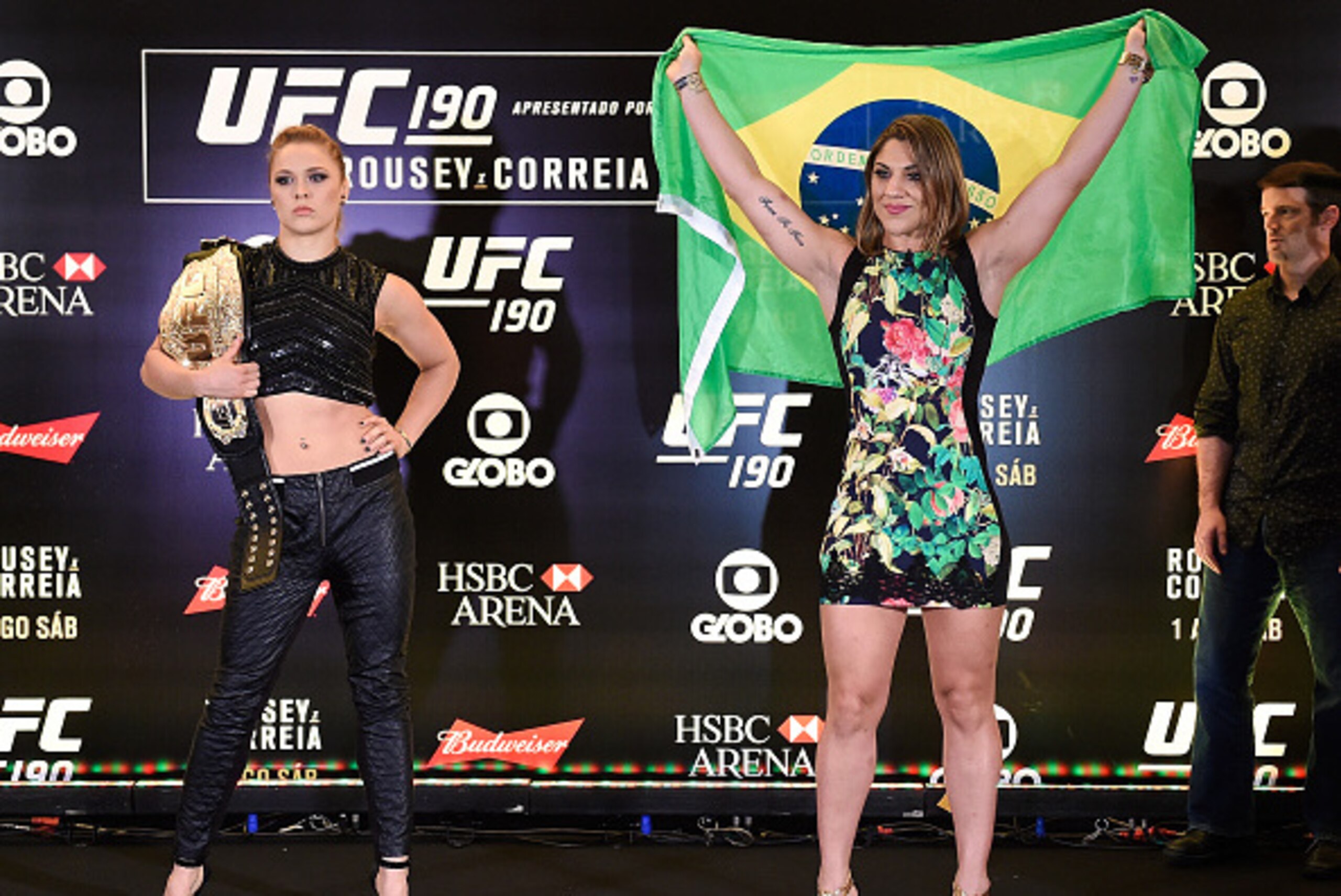 RIO DE JANEIRO, BRAZIL - JULY 30:  Bantamweight fighters Ronda Rousey (L) of the United States and Bethe Correia of Brazil pose for photographers during Ultimate Media Day at Sheraton Hotel on July 30, 2015 in Rio de Janeiro, Brazil.  (Photo by Buda Mende