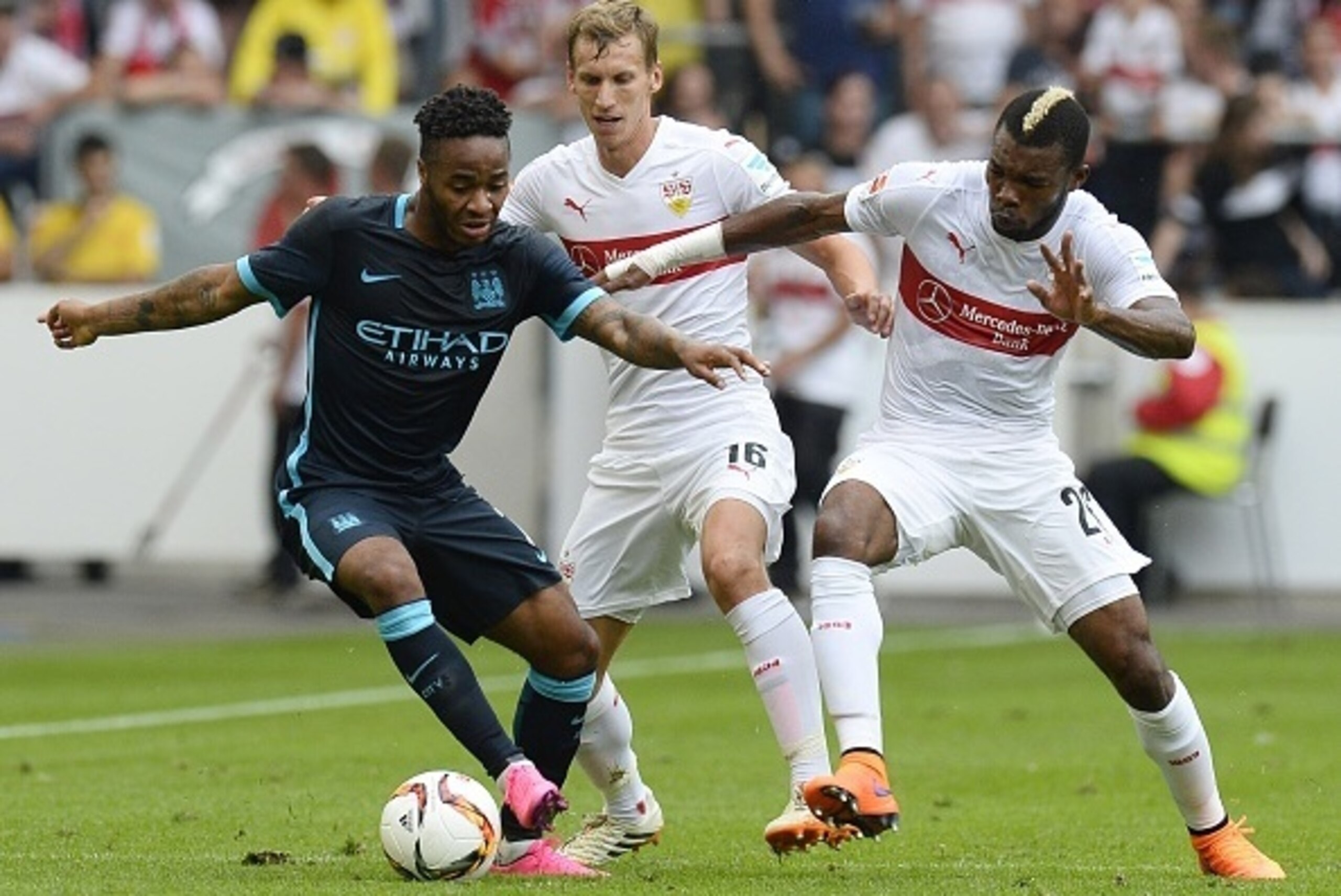 Stuttgart's Ivorian midfielder Serey Die (R) and Austrian defender Florian Klein vie for the ball with Manchester's midfielder Raheem Sterling during the friendly football match between VfB Stuttgart and Manchester City in Stuttgart, southern Germany, on Stuttgart's Ivorian midfielder Serey Die (R) and Austrian defender Florian Klein vie for the ball with Manchester's midfielder Raheem Sterling during the friendly football match between VfB Stuttgart and Manchester City in Stuttgart, southern Germany, on
