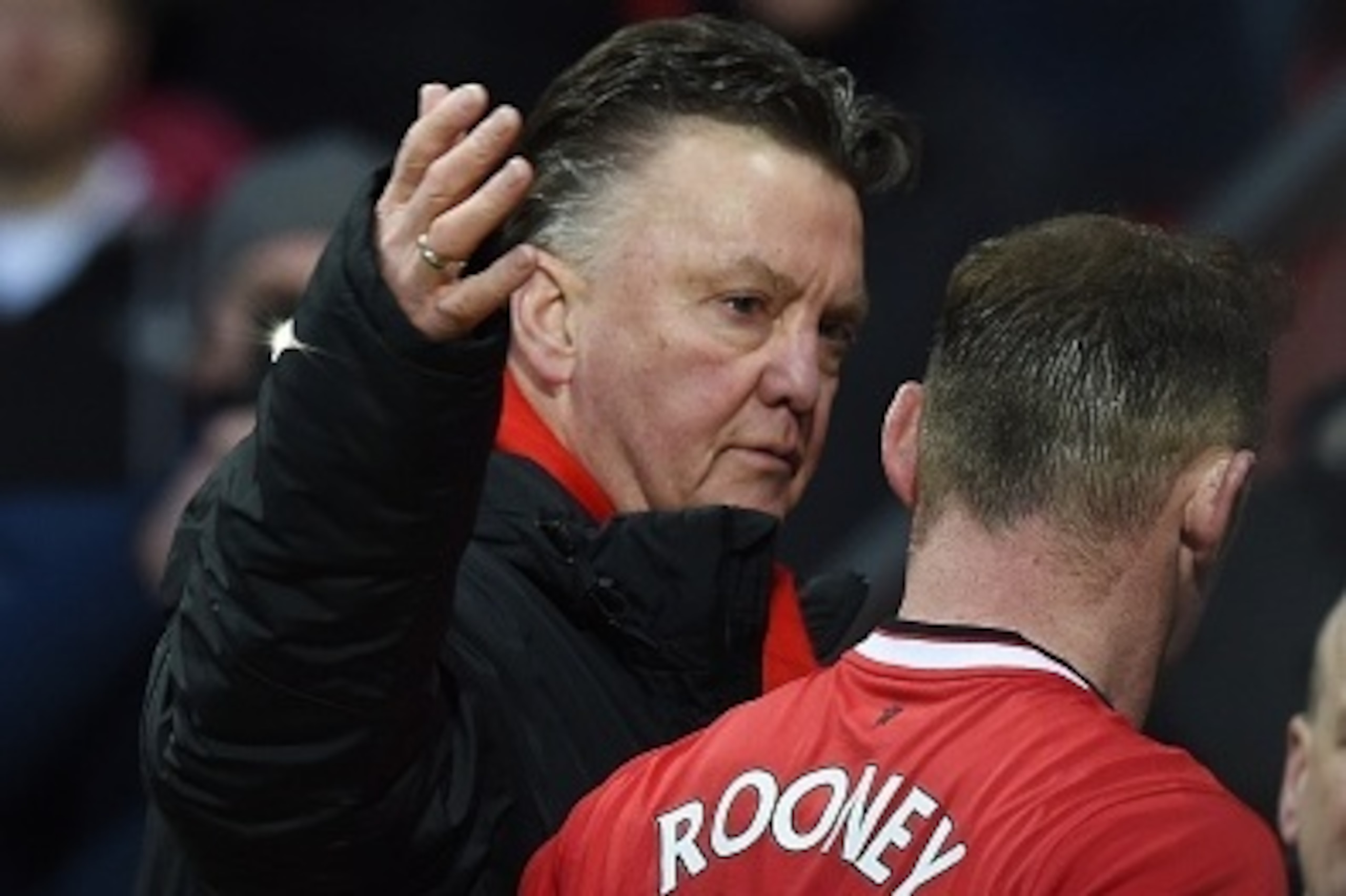 Manchester United's Dutch manager Louis van Gaal (L) embraces Manchester United's English striker Wayne Rooney (R) as they leave the pitch during the English Premier League football match between Manchester United and Leicester City at Old Trafford in Man Manchester United's Dutch manager Louis van Gaal (L) embraces Manchester United's English striker Wayne Rooney (R) as they leave the pitch during the English Premier League football match between Manchester United and Leicester City at Old Trafford in Man