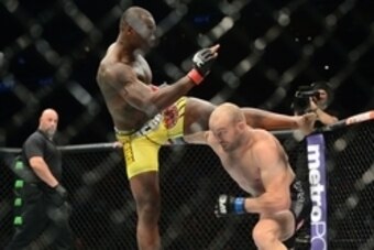 Apr 18, 2015; Newark, NJ, USA; Ovince Saint Preux  (red) and Patrick Cummins (blue) fight during UFC Fight Night at Prudential Center. Saint Preux won via first round TKO. Mandatory Credit: Joe Camporeale-USA TODAY Sports