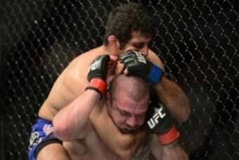 Apr 18, 2015; Newark, NJ, USA; Jim Miller (red) and Deneil Dariush (blue) fight during UFC Fight Night at Prudential Center. Dariush won via unanimous decision. Mandatory Credit: Joe Camporeale-USA TODAY Sports