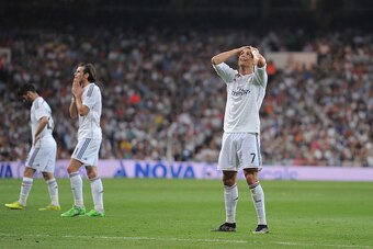 MADRID, SPAIN - MAY 09:  Cristiano Ronaldo of Real Madrid CF reacts after failing to score from a free kick during the La Liga match between Real Madrid CF and Valencia CF at Estadio Santiago Bernabeu on May 9, 2015 in Madrid, Spain.  (Photo by Denis Doyl