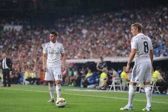 MADRID, SPAIN - AUGUST 25:  Toni Kroos and James Rodriguez of Real Madrid get ready to take a free kick during the La liga match between Real Madrid CF and Cordoba CF at Estadio Santiago Bernabeu on August 25, 2014 in Madrid, Spain.  (Photo by Denis Doyle