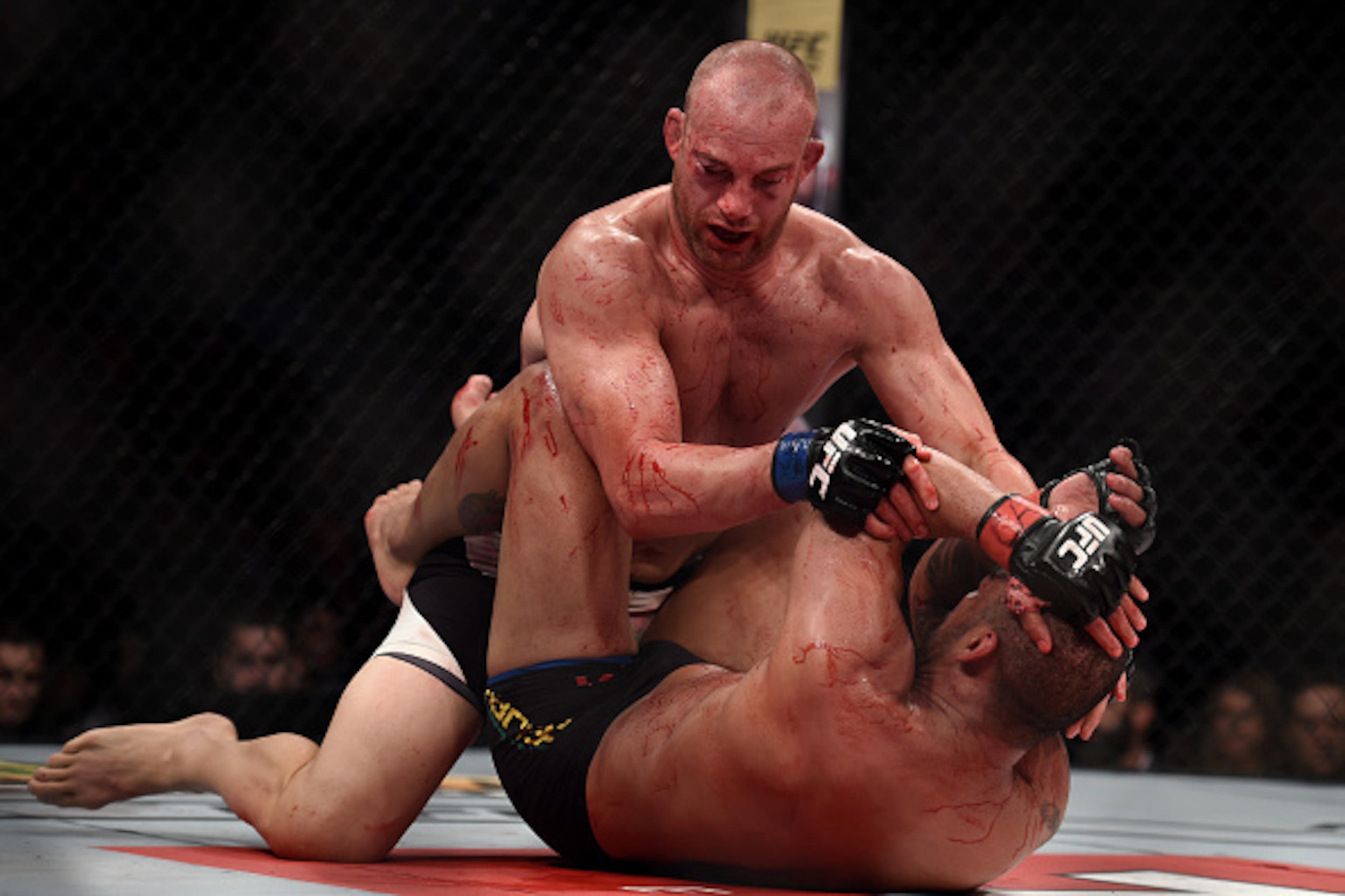 RIO DE JANEIRO, BRAZIL - AUGUST 01:  Patrick Cummins of the United States punches Rafael Cavalcante of Brazil States in their light heavyweight bout during the UFC 190 Rousey v Correia at HSBC Arena on August 1, 2015 in Rio de Janeiro, Brazil.  (Photo by 